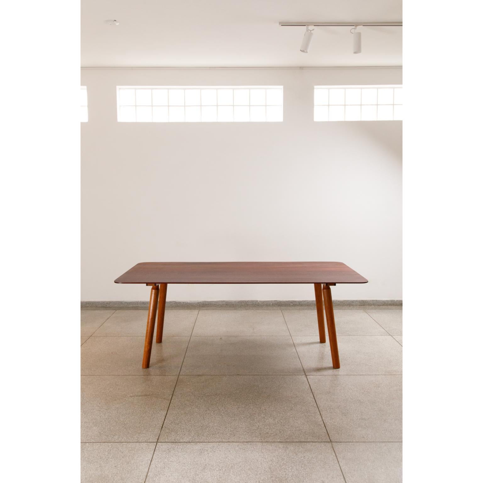 Solid Jatobá and Tauari Wood Asa Dining Table by Andreas Anwander
Dimensions:  W 200 x D 100 x H 75 cm
Materials: Solid Jequitibá and Tauari Wood.
Weight: 50 kg.

As light as a wing and as sturdy as a tree. The dining table for 6 to 8 seats has