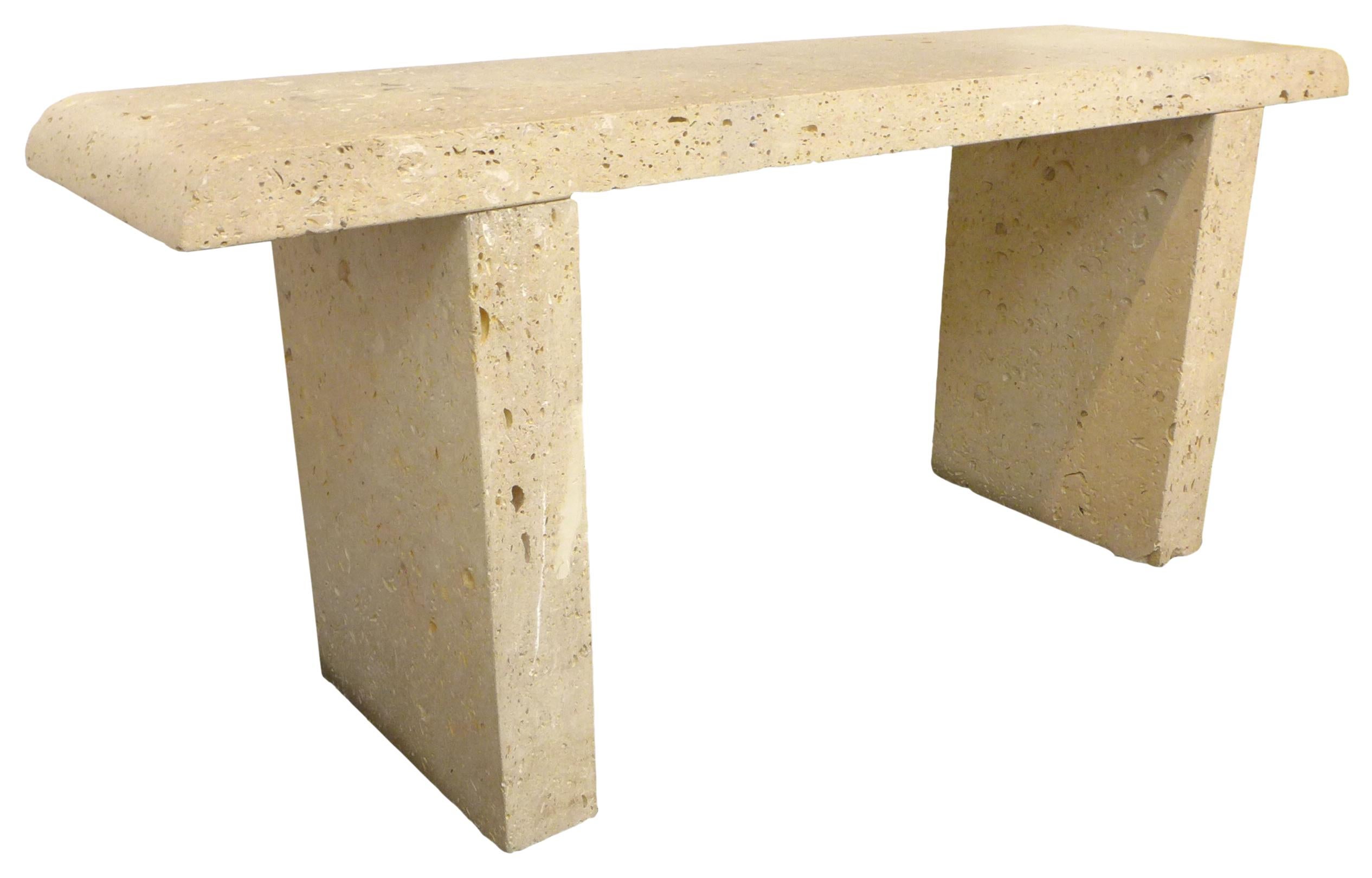 A simple, but decoratively powerful, limestone slab console table. Minimalist in form with a subtle, radiused top-ends detail. A fine example of a beautiful, raw material presented in an elegant rectilinear form. A utilitarian and decoratively