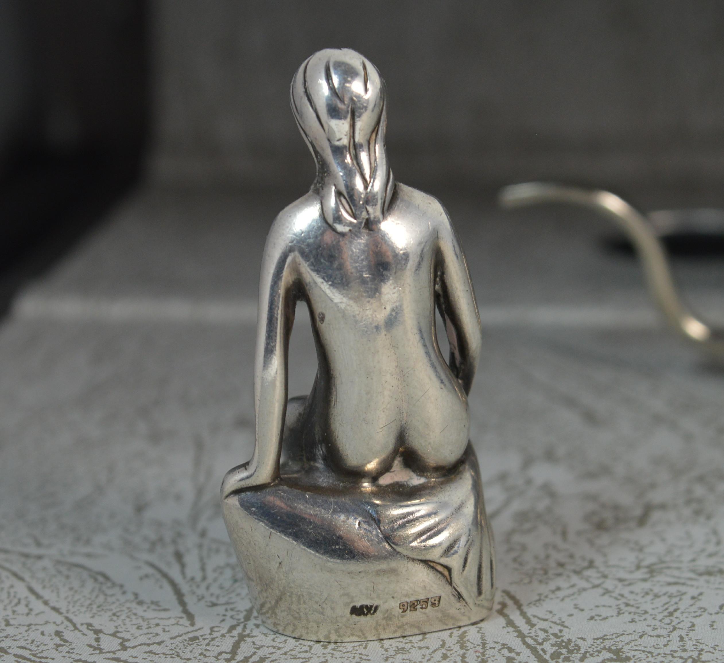 silver mermaid statue