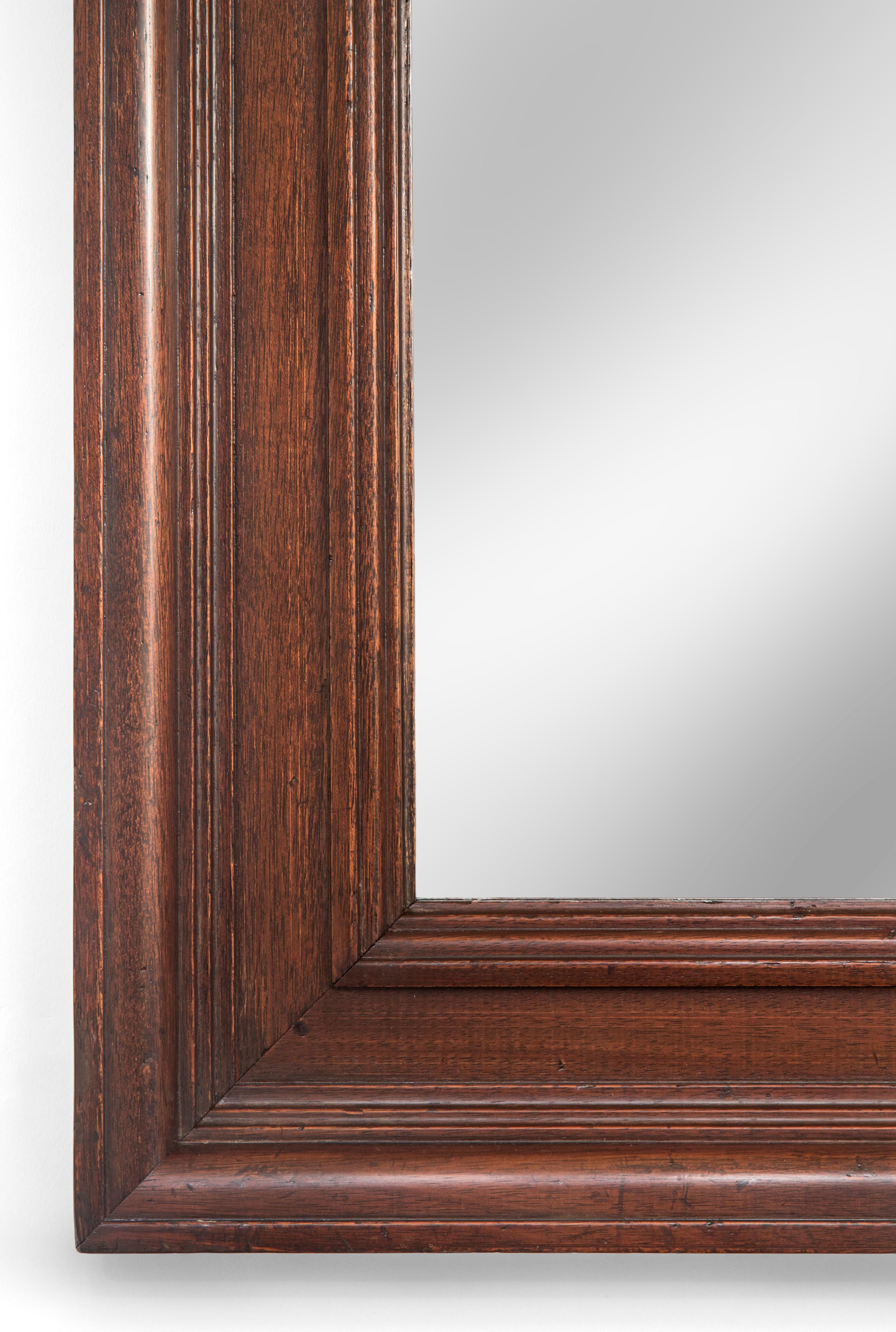 Solid mahogany framed mirror
19th century
Simplicity is sometimes the most handsome of all; this beautiful mirror would grace any interior. The antique rectangular glass within a molded solid mahogany frame.