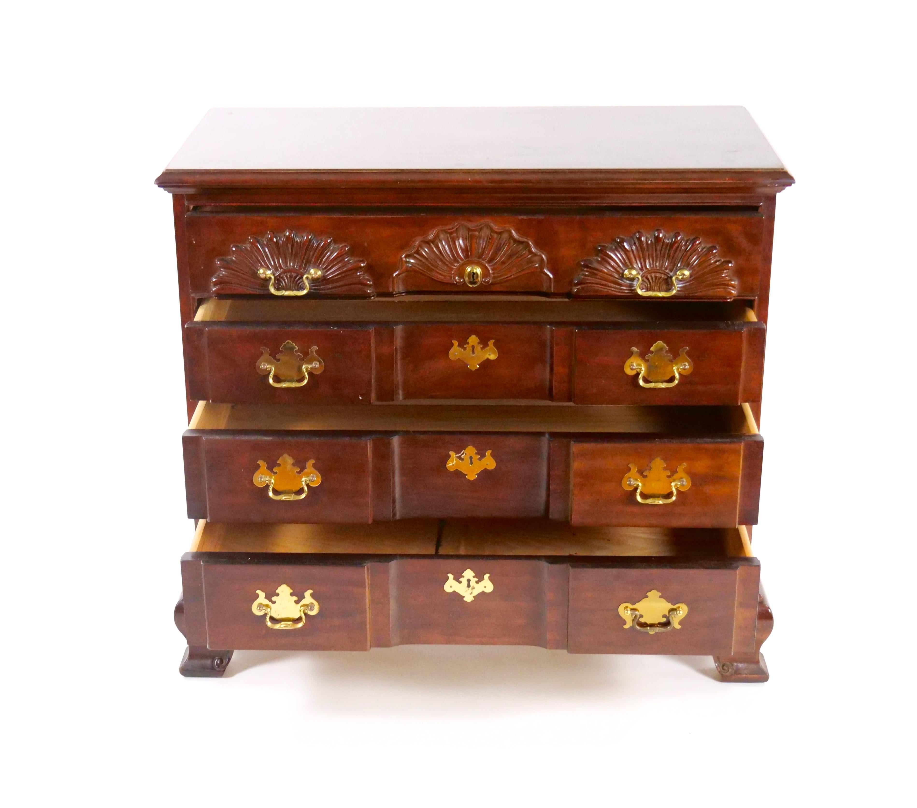 Introduce timeless elegance and versatile functionality to your home with this exquisite Chippendale style Solid Mahogany Four Drawer Chest of Drawers / Commode. Crafted from solid carved mahogany in the mid-20th century, this piece exudes classic