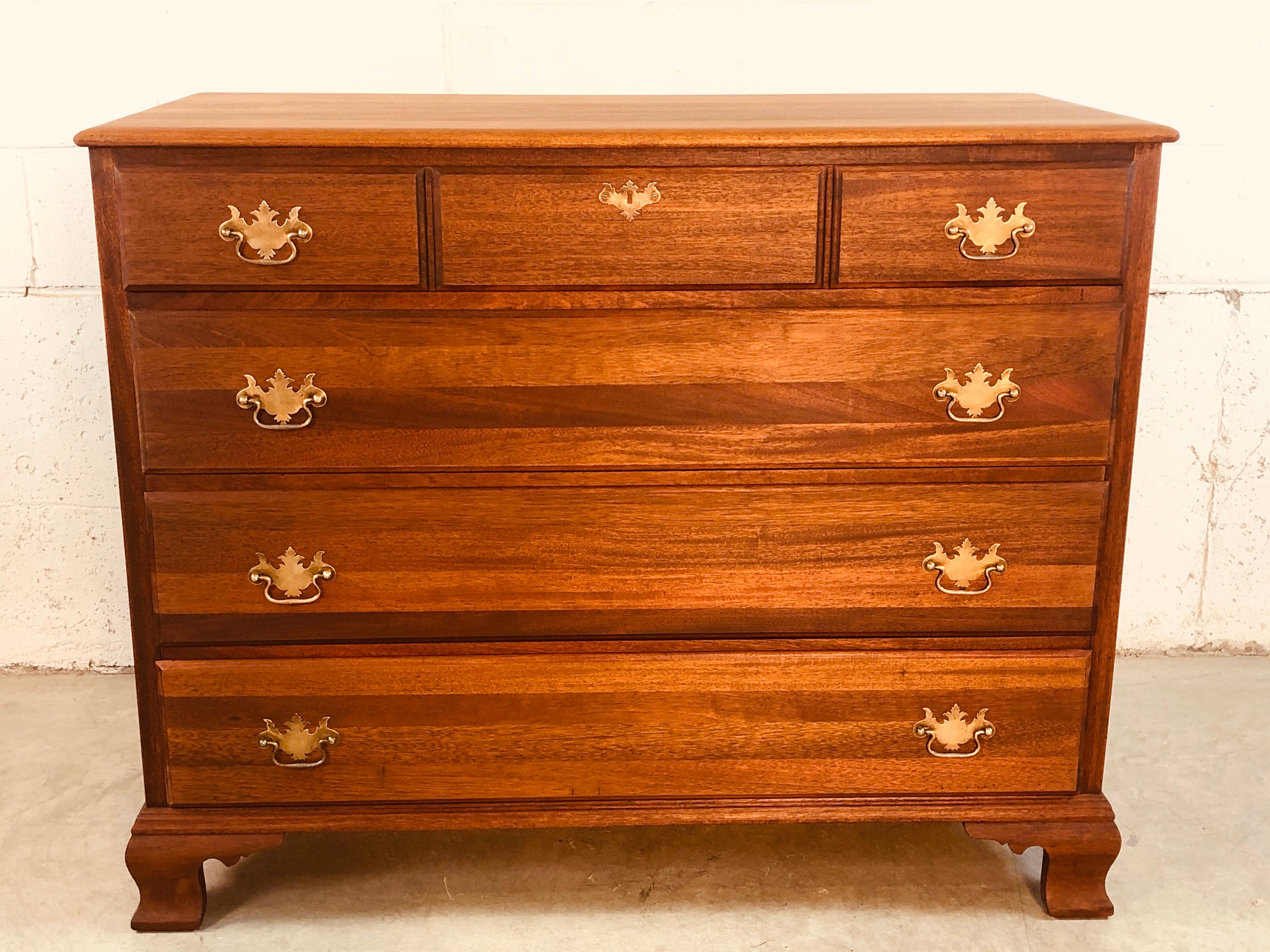 Vintage solid mahogany four-drawer dresser with brass pulls. The dresser is newly refinished and has lots of storage. Marked in the drawer and dated 1947 on the back. The dresser is in excellent condition.