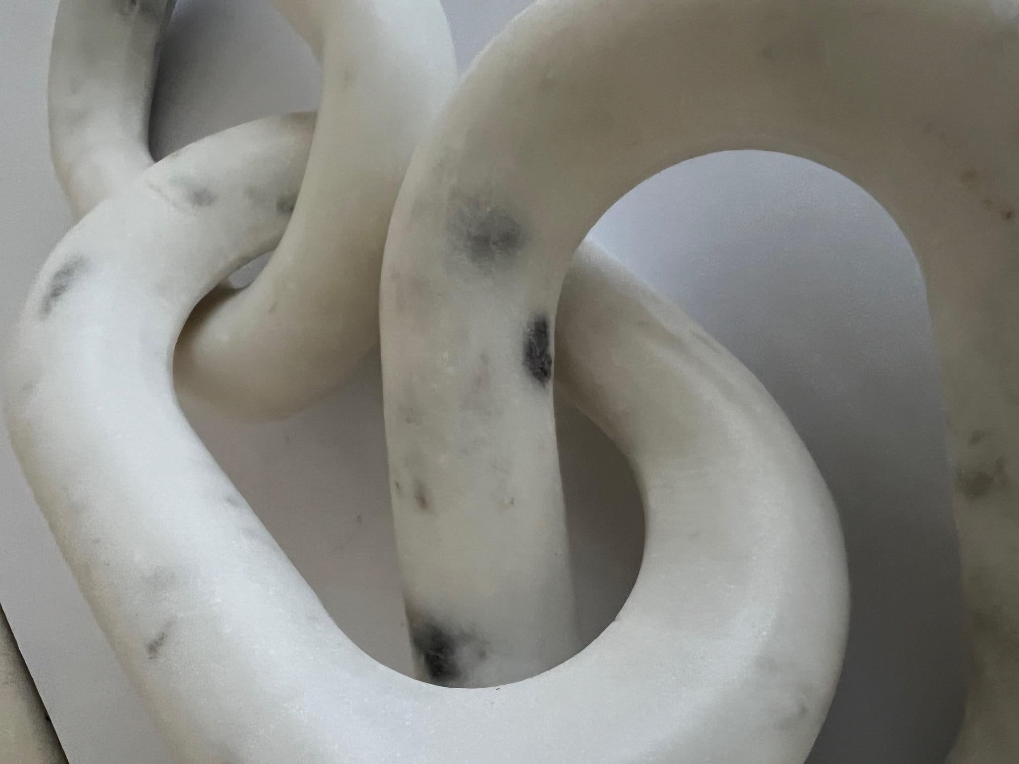 Solid marble chain designed by Regina Andrew Detroit, is named the Atlas Marble Chain. The link of three was made in the USA in the 21st Century. 