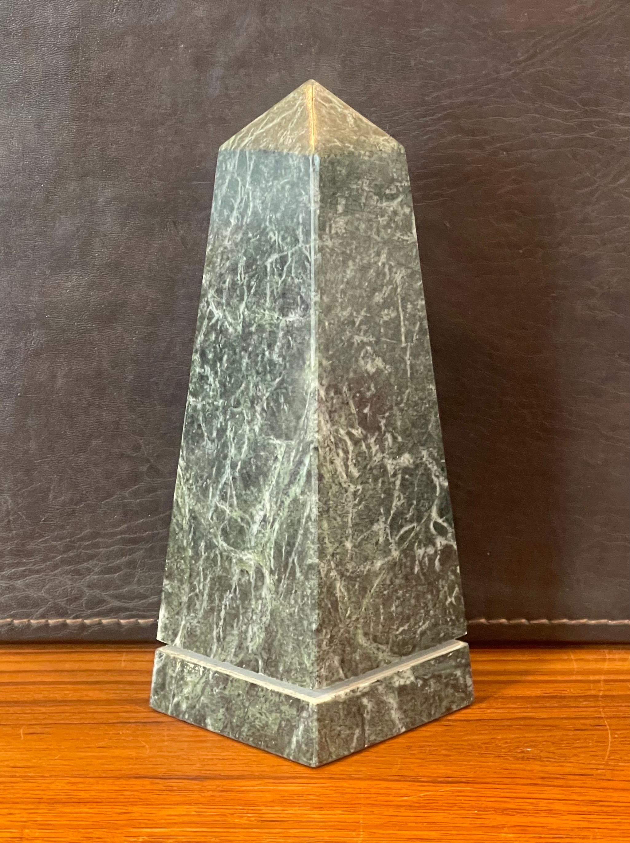 Beautiful solid green marble decorative obelisk, circa 1970s. The piece is in very good vintage condition with no chips or cracks and is nicely polished. The piece is 2.75