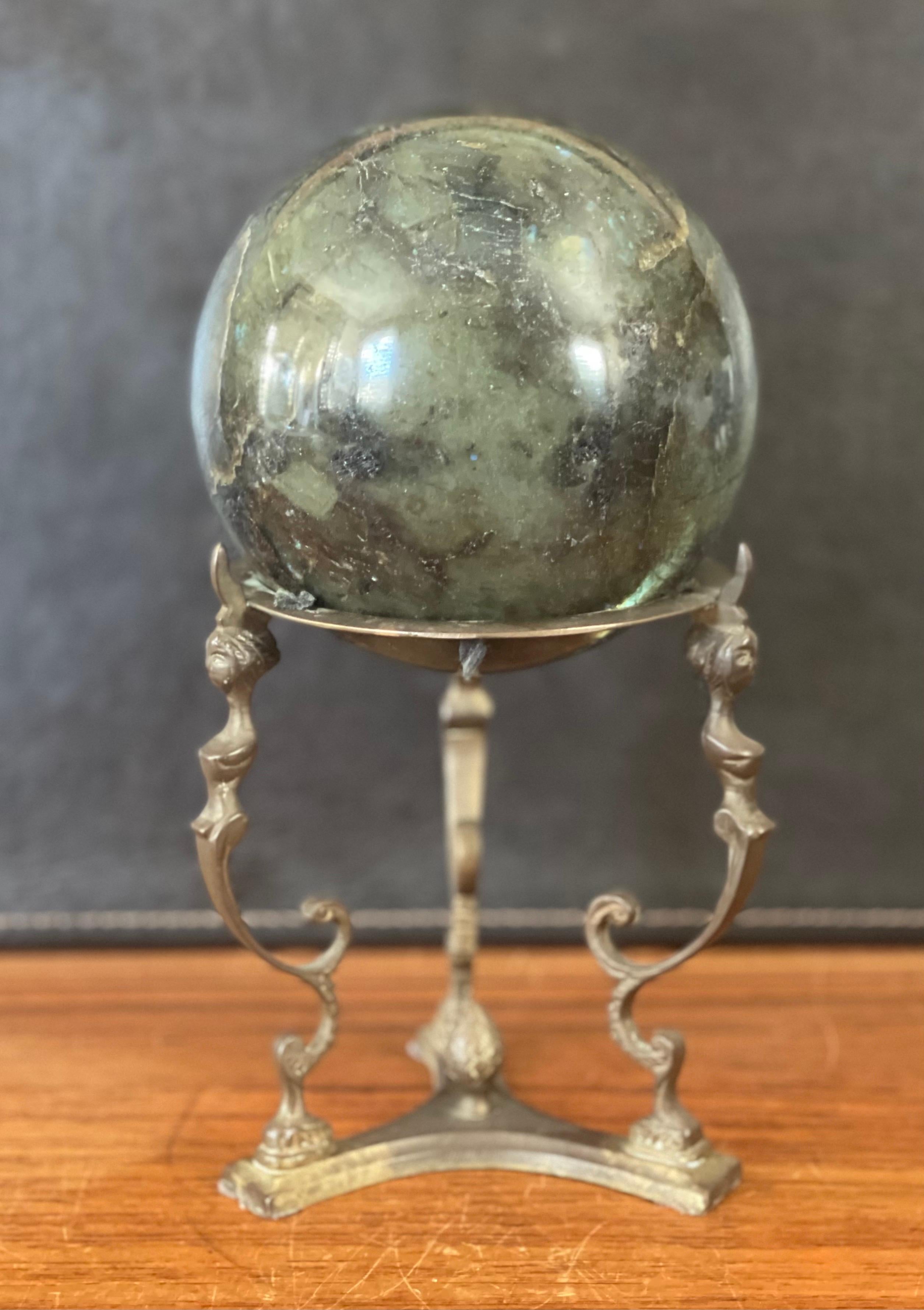 Beautiful solid green marble decorative sphere on bronze base, circa 1970s. The piece is in very good condition with no chips or cracks; it has a nice polished finish with with white and grey veining and speckles. The sphere measures 5
