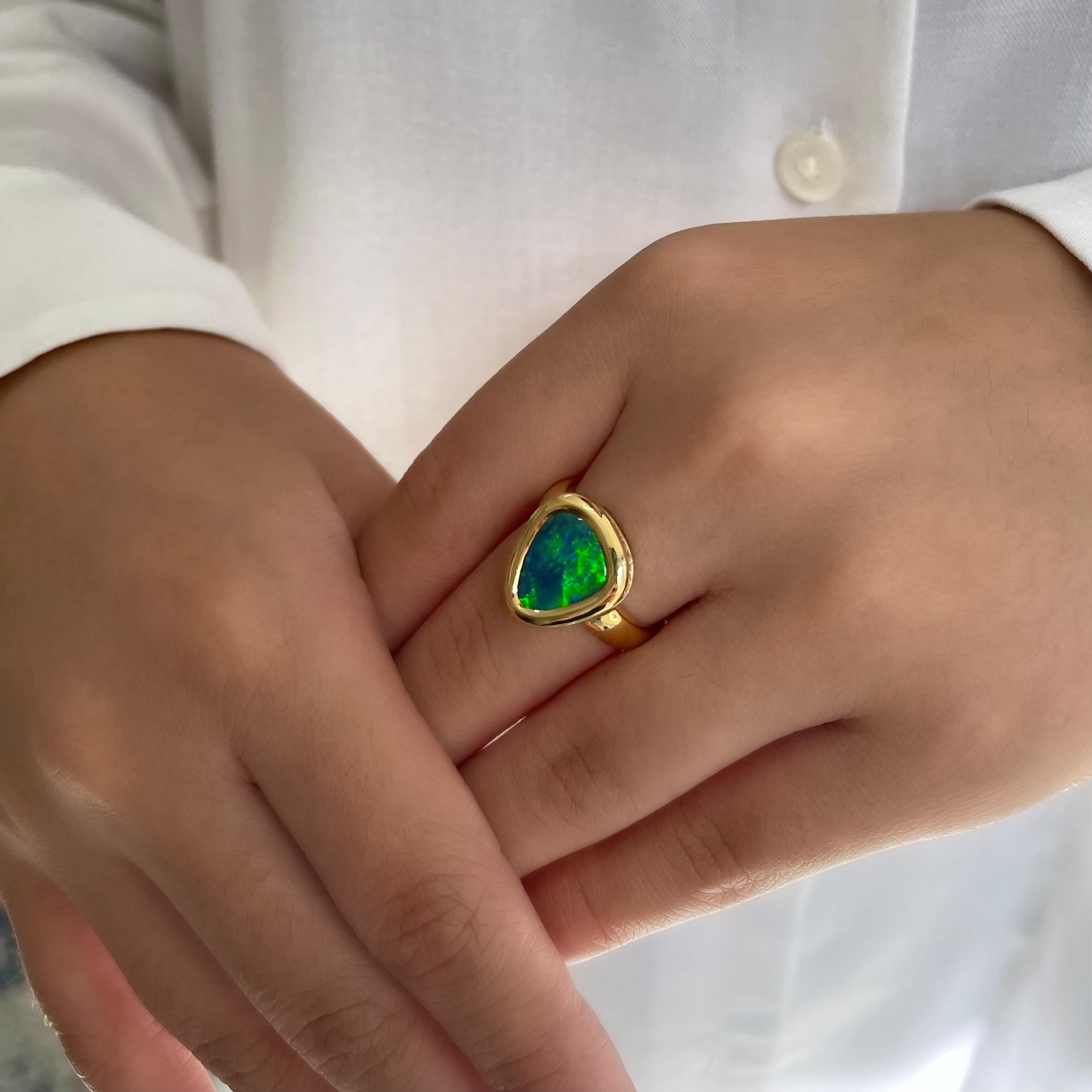The graceful and exquisite ‘Love at First Kiss’ ring features an immaculate black opal (2.57ct) hailing from famous Lightning Ridge mines in NSW, Australia. The harmony of the green and blue play-of-colour in this ring is a remarkable feat of mother