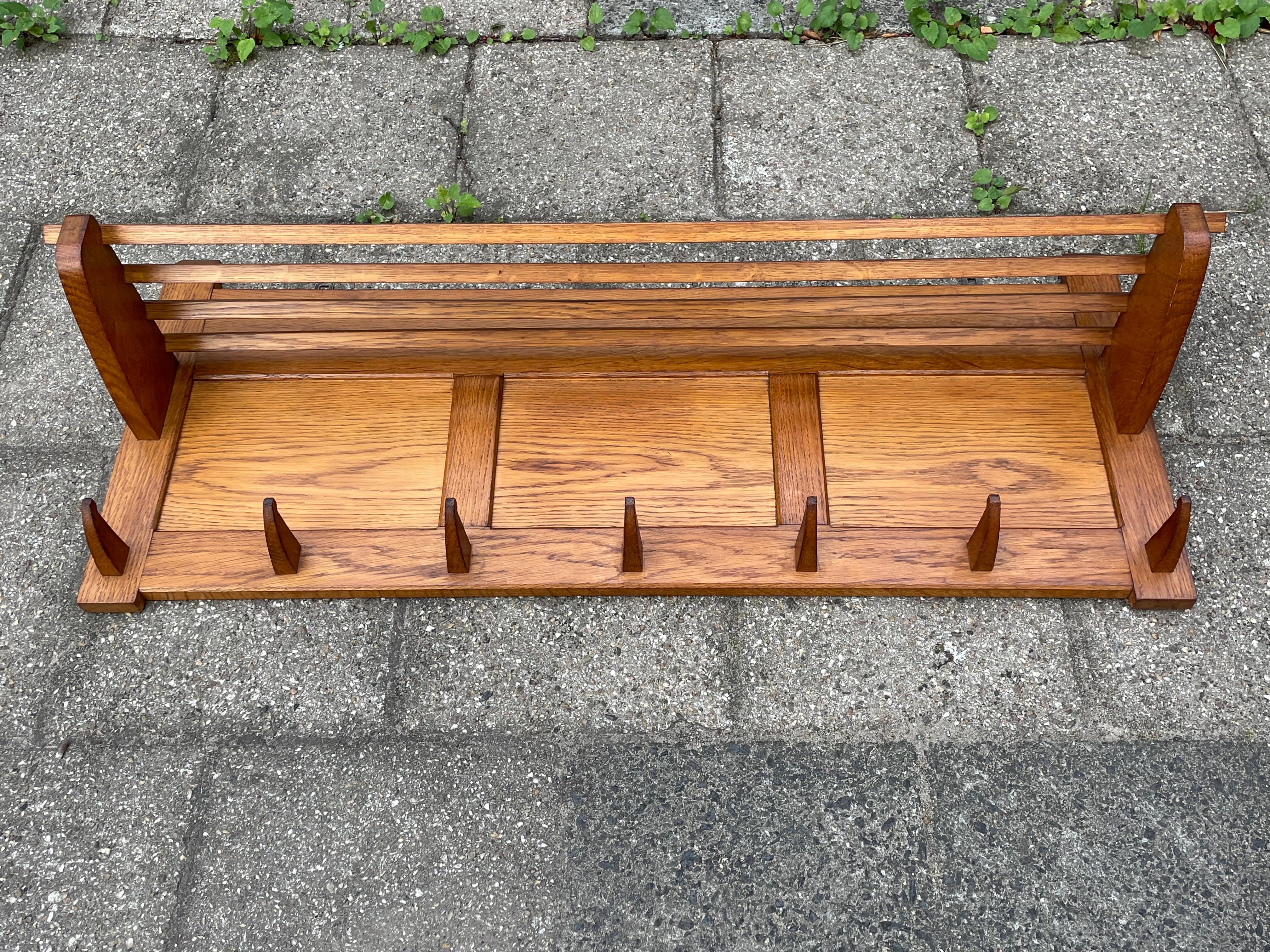 Very stylish and museum worthy condition, Arts and Crafts wall coat rack.

This rare coat rack is entirely original and if you are looking for a top quality and highly practical one to grace your entrance then this fine specimen could be perfect