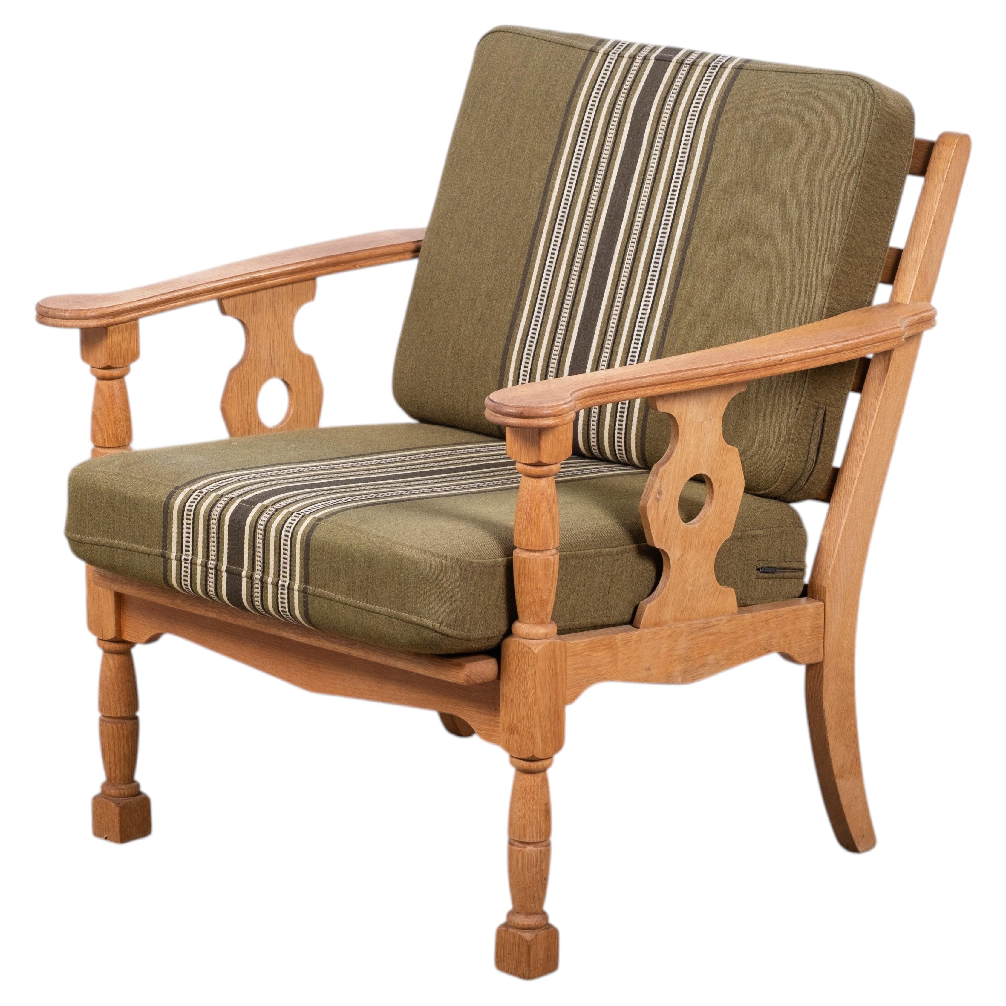 Solid Oak Armchair by Henning Kjærnulf, Denmark, 1960s For Sale