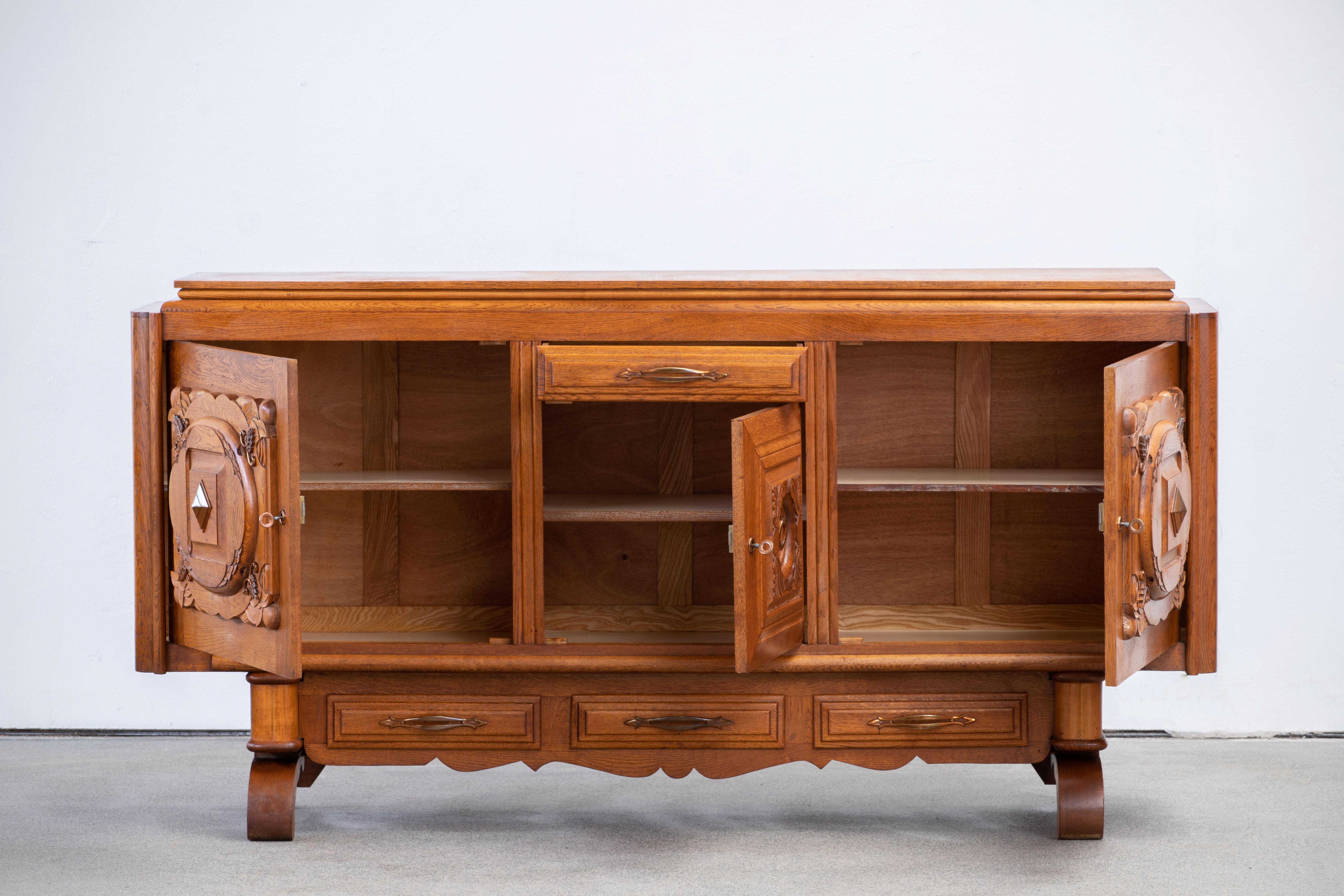 Sideboard, oak, France, 1940s

The sideboard is in excellent original condition, with minor wear consistent with age and use.
 