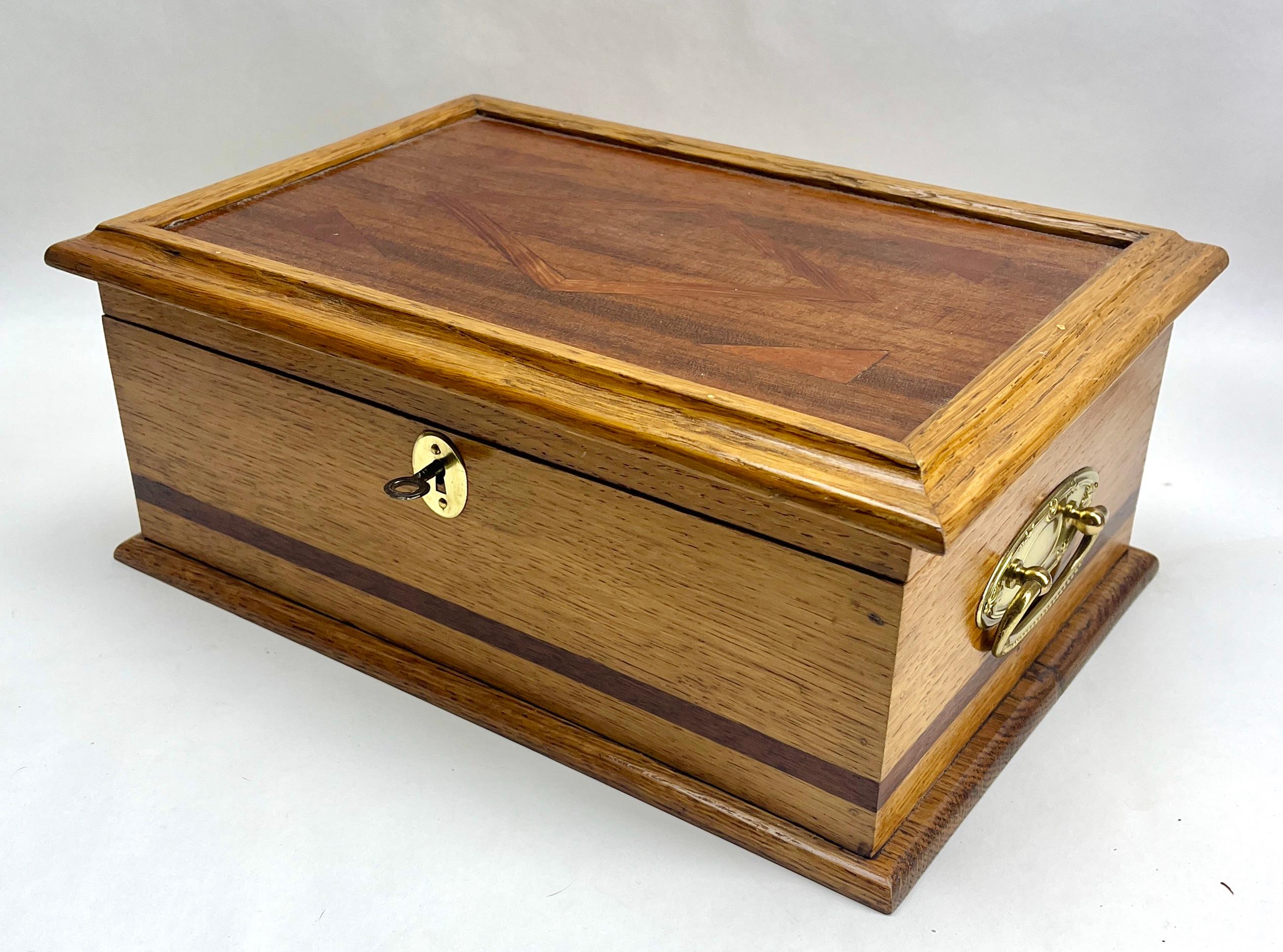 Solid oak Arts & Crafts box, Austria, circa 1910s
Originel key available

A solid oak box from the Arts & Crafts period,
Made in Austria.
A very special item with decorative Brass metalwork  
Definitely one of a kind.
Looks simply stunning.

Please