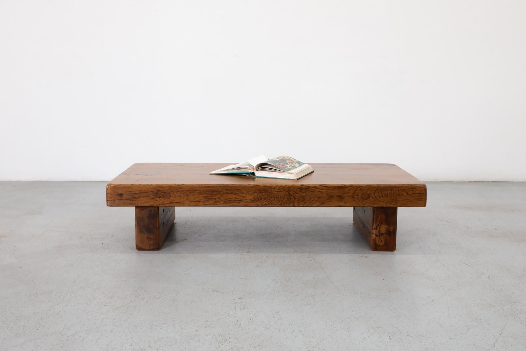 Gorgeous Pierre Chapo Style Brutalist solid oak coffee table on solid oak legs. In original condition with some visible wear and scratching consistent with age and use. Top is 4.25” thick. Very heavy.