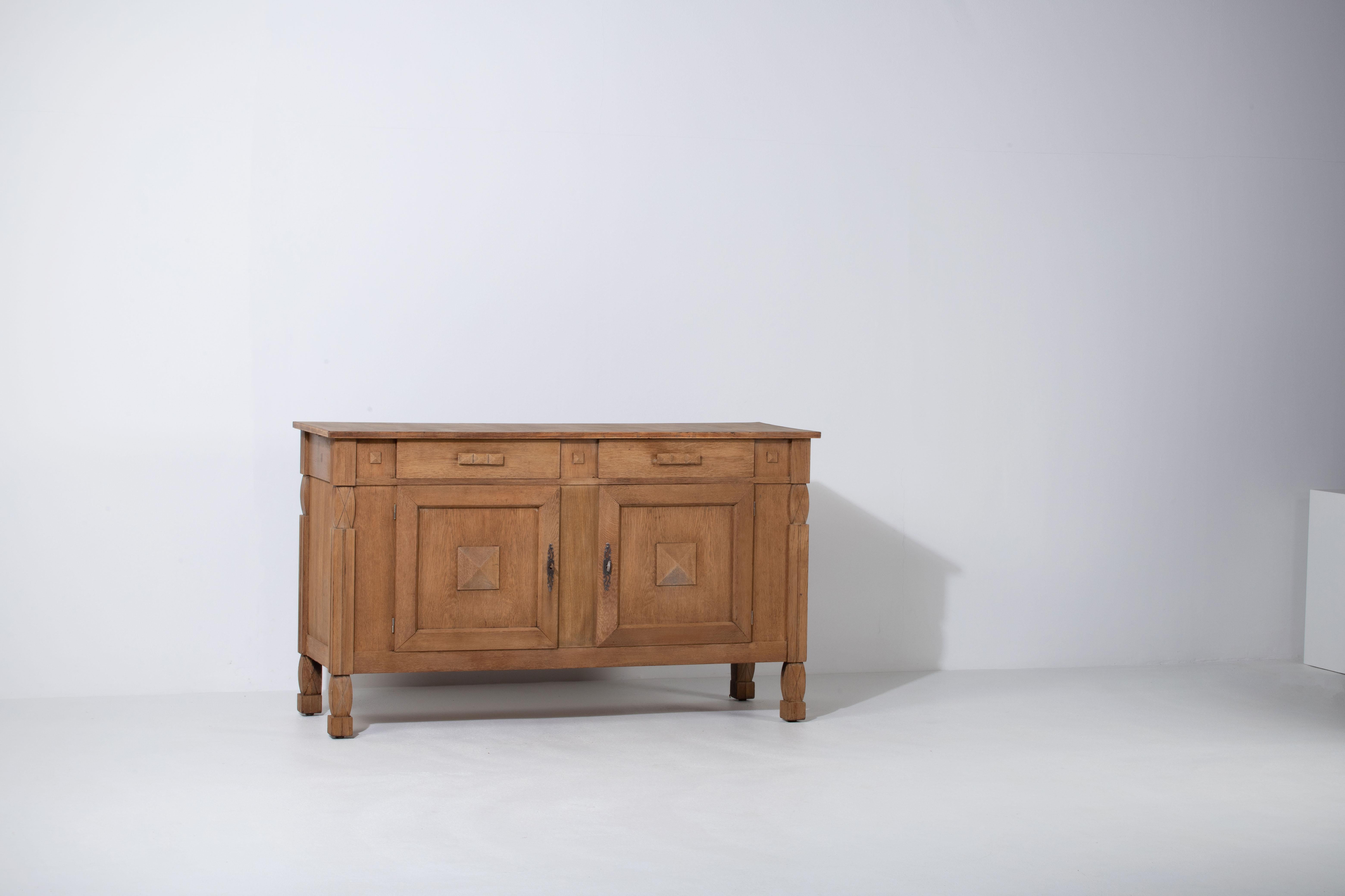 Credenza, solid oak, France, 1940s.
The credenza consists of two storage facilities and covered with very detailed designed doors.
We offer this piece in a bleached finish.