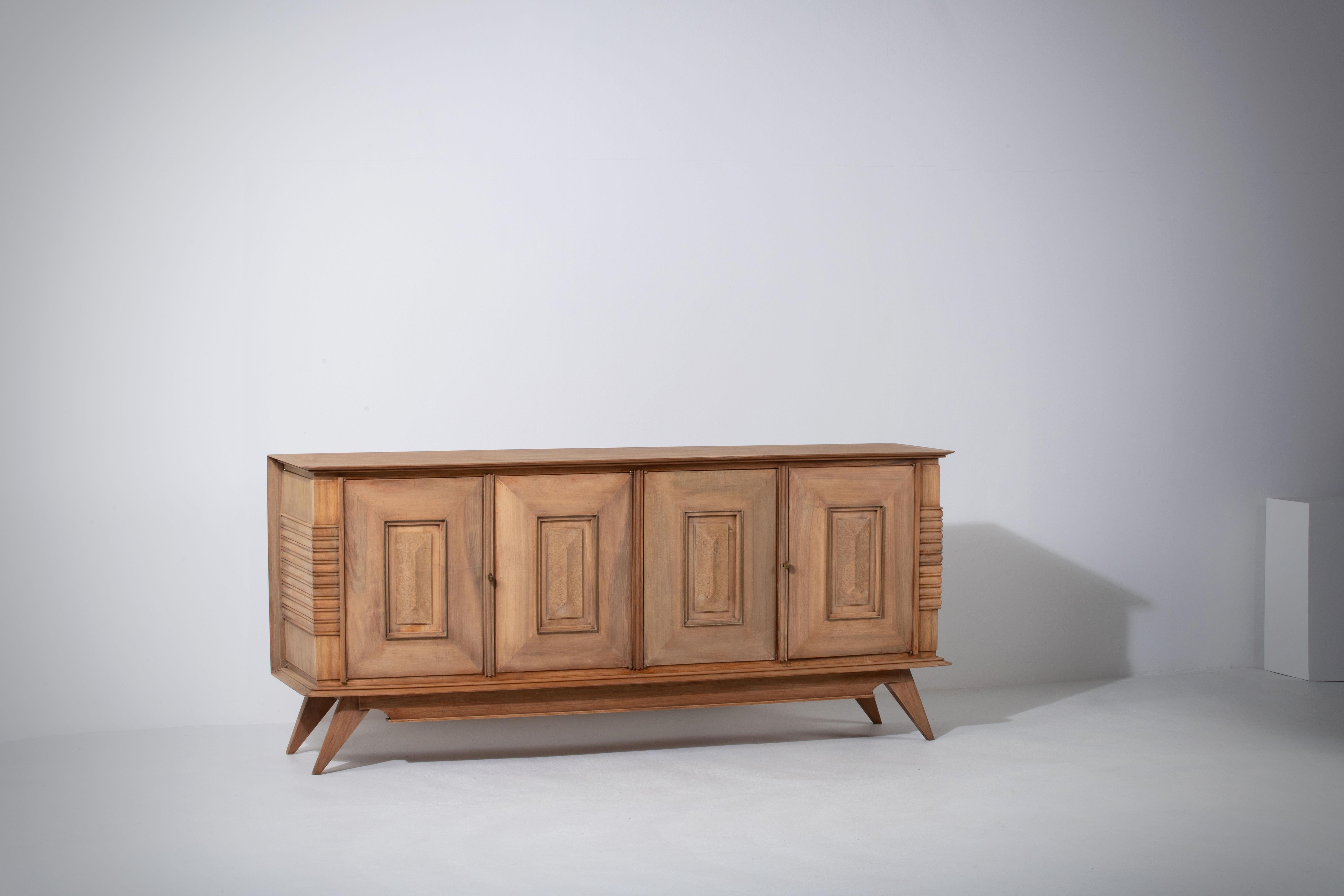 Credenza, solid oak, France, 1940s.
The credenza consists of four storage facilities covered with detailed doors.
We offer this piece in a bleached finish.
