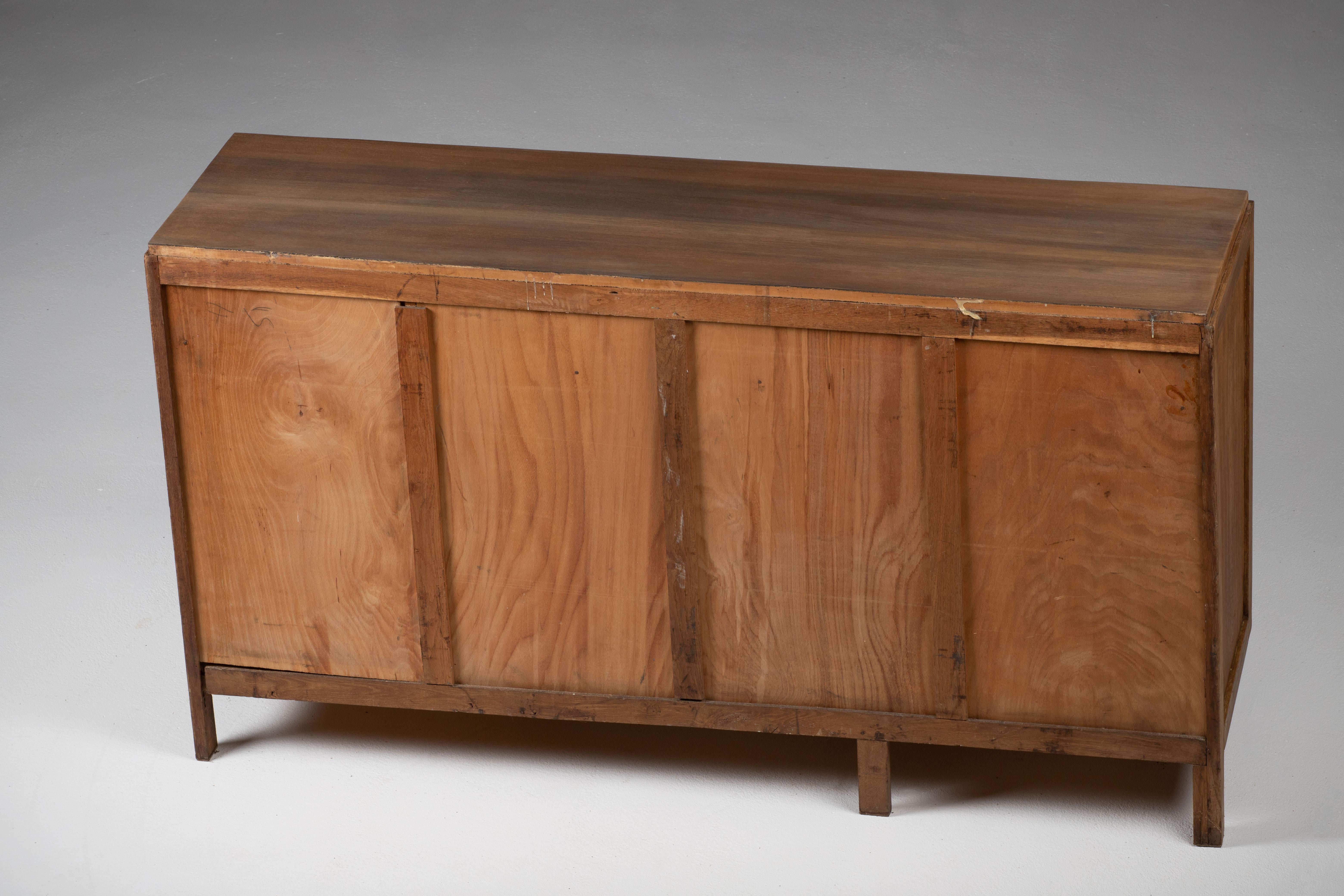 Credenza, solid oak, France, 1940s.
Large Art Deco Brutalist sideboard. 
This is a typical reconstruction piece, straight lines and quality materials.
Condition report : right door is warped, the doors can be shut but not locked.