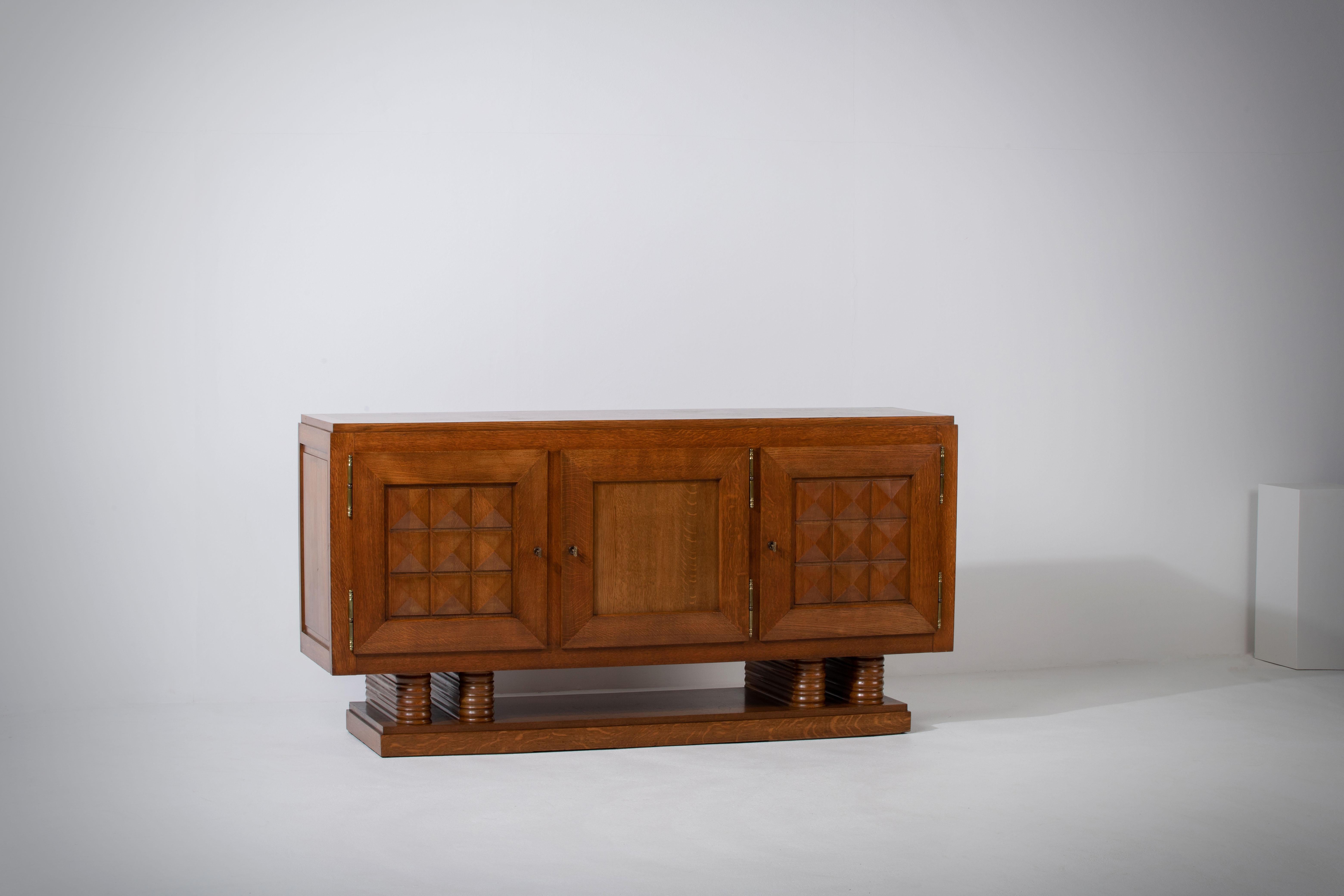 Introducing an extraordinary one-of-a-kind oak sideboard designed by the renowned French designer Gaston Poisson in the 1940s. Gaston Poisson was a prominent furniture designer in the early to mid-20th century, known for his remarkable