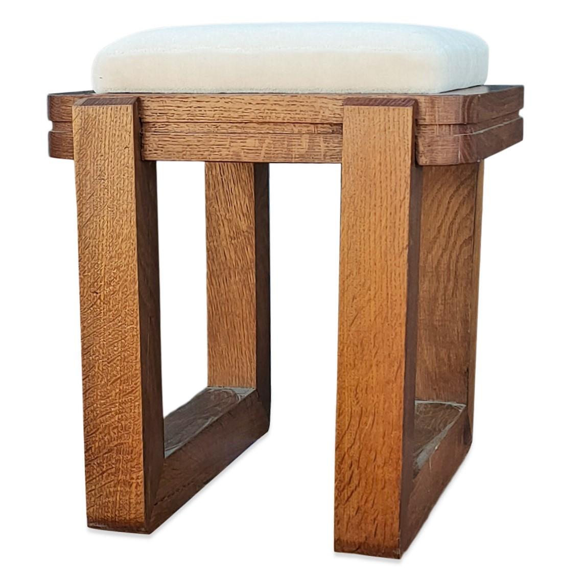Minimalist solid oak stool 
nice carved details on upper belt
minor repairs on inner side cracks (please see pictures)
fresh cream mohair upholstery
this item will ship from France and can be returned to either France or NYC NY location
price