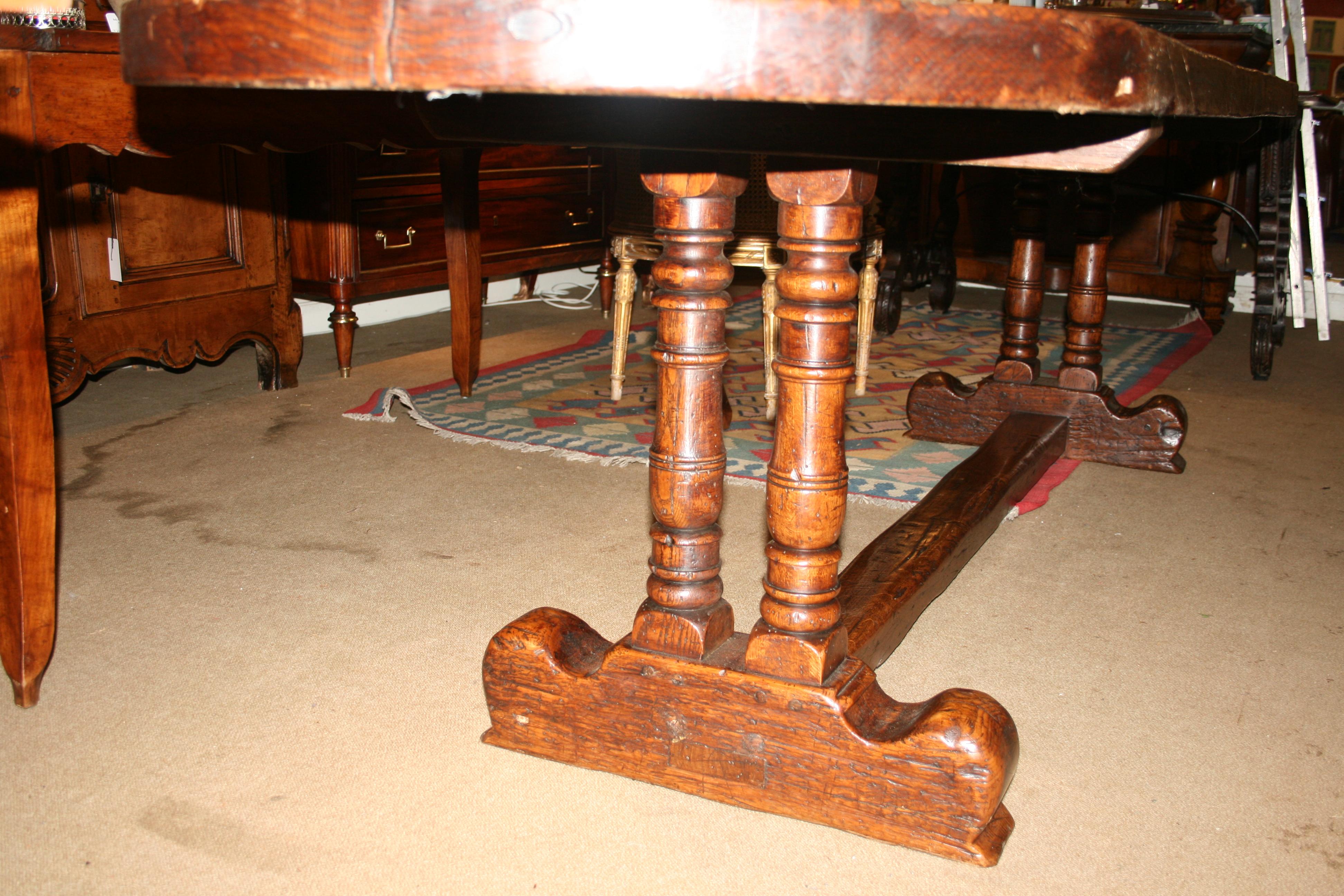 Superb oak table with top being one piece of timber with very good color and patina, base form of twin columns and stretcher in 17th century style.