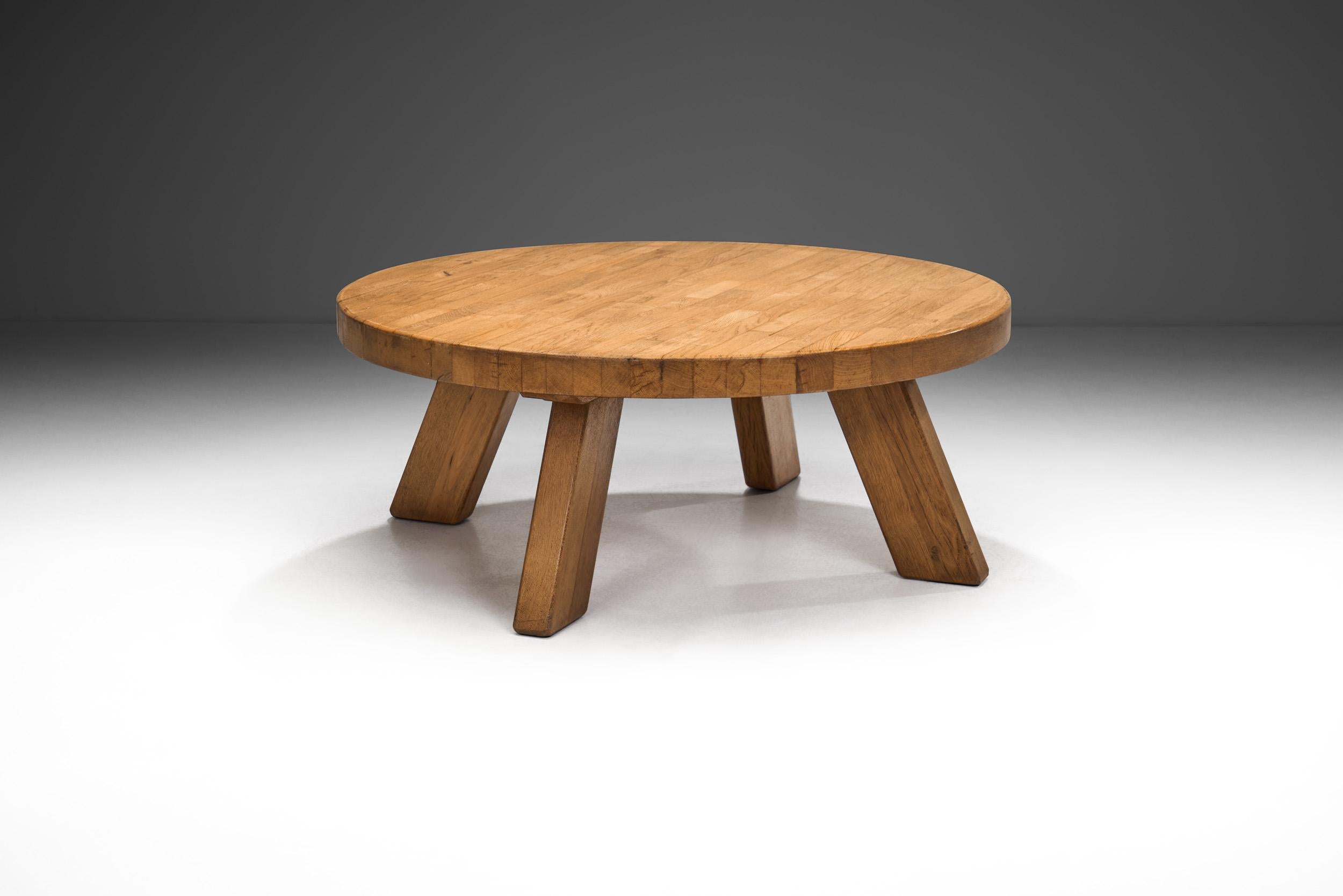 In European, and thus in Dutch mid-century furniture design, there was an early emphasis on wood as it connected everyday objects, such as furniture to nature. This rustic, solid oak coffee table is a perfect example of this sentiment, and the
