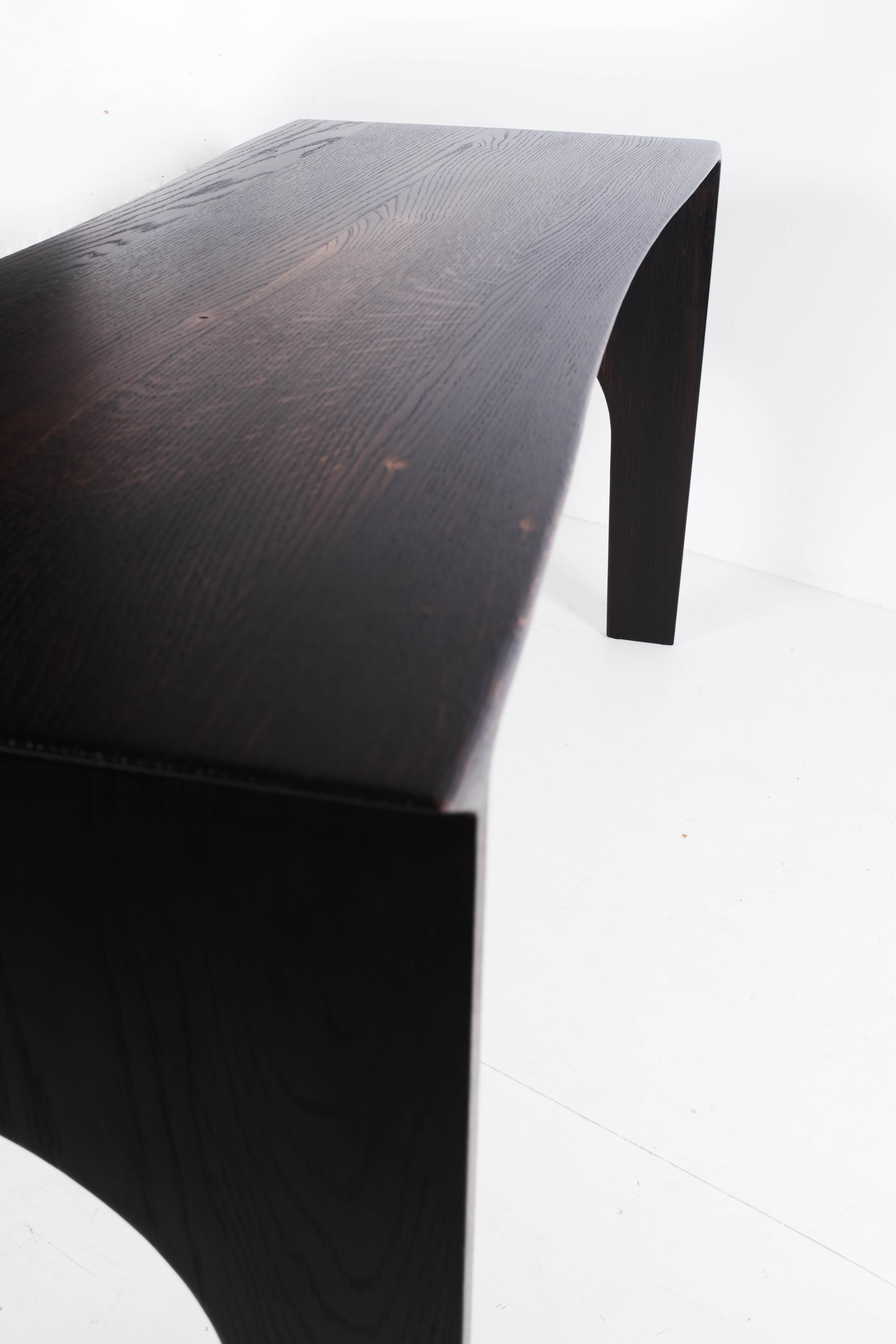 Solid oak sculptural desk by Lukas Cober
160 x 60 x 75 cm
Could be made to order in other dimension
Material / solid oak wood
Finish / burned, waxed
Variations / stool, bench, desk, dining table, coffee table

