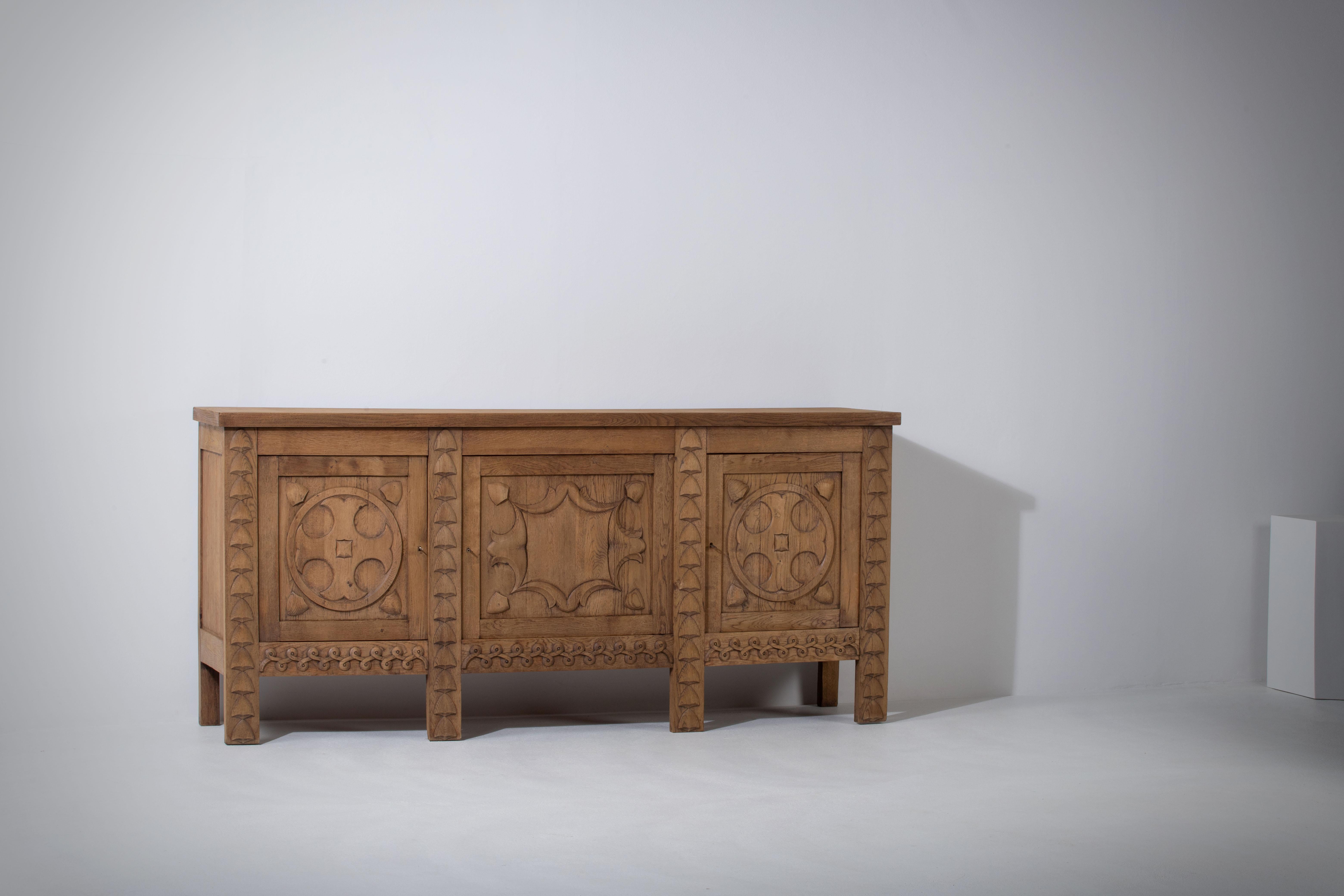 A matching sideboard is available.
Brutalist solid Elm sideboard, credenza.
The buffet features stunning oak structure on door panels. It offers ample storage, with shelve behind the doors. 
A unique blend of Art Deco Spanish and Brutalist Modern