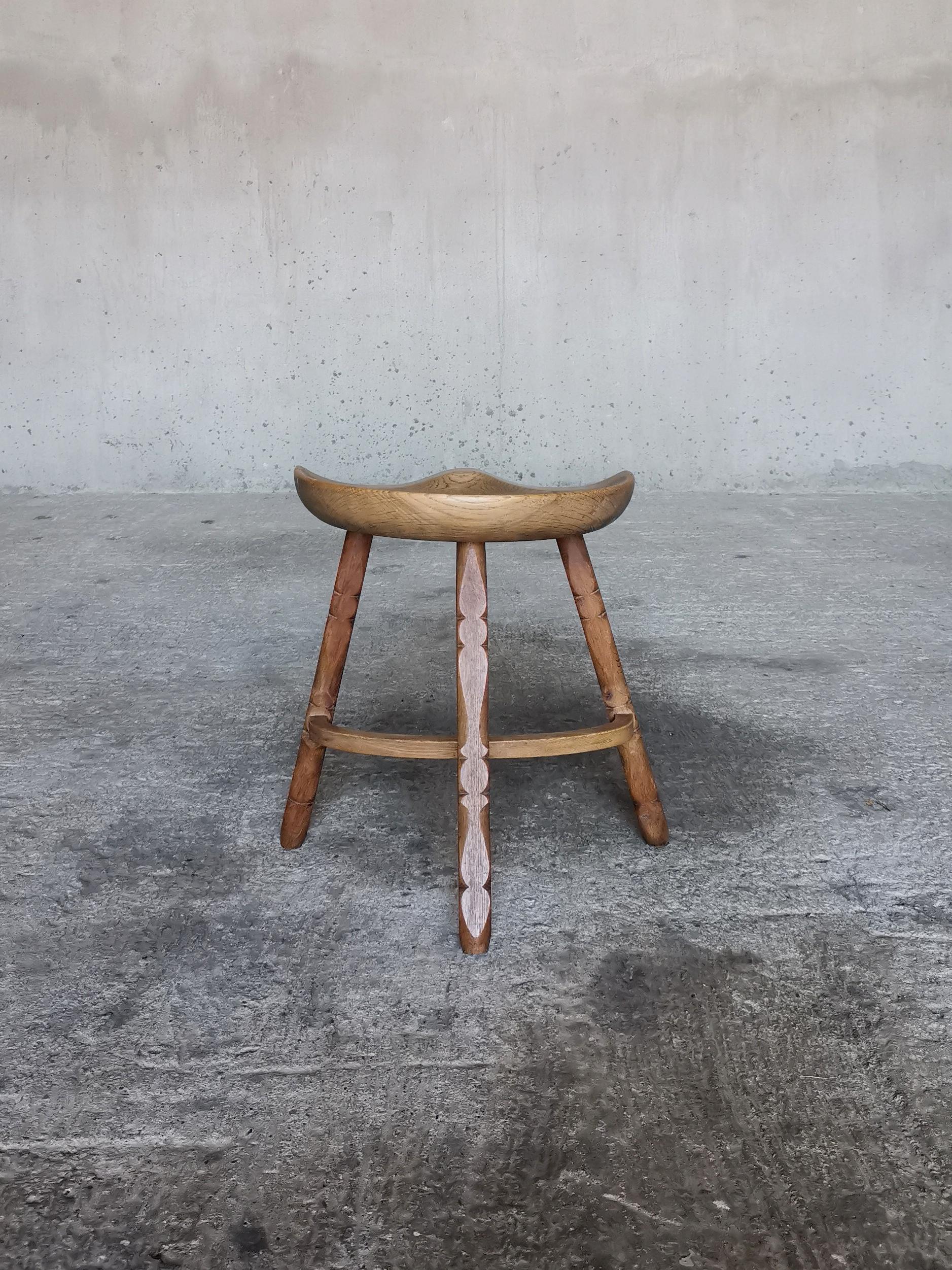 Turned Solid oak stool in style of Henning Kjærnulf, hand sculpted seat, Denmark 1960s  For Sale