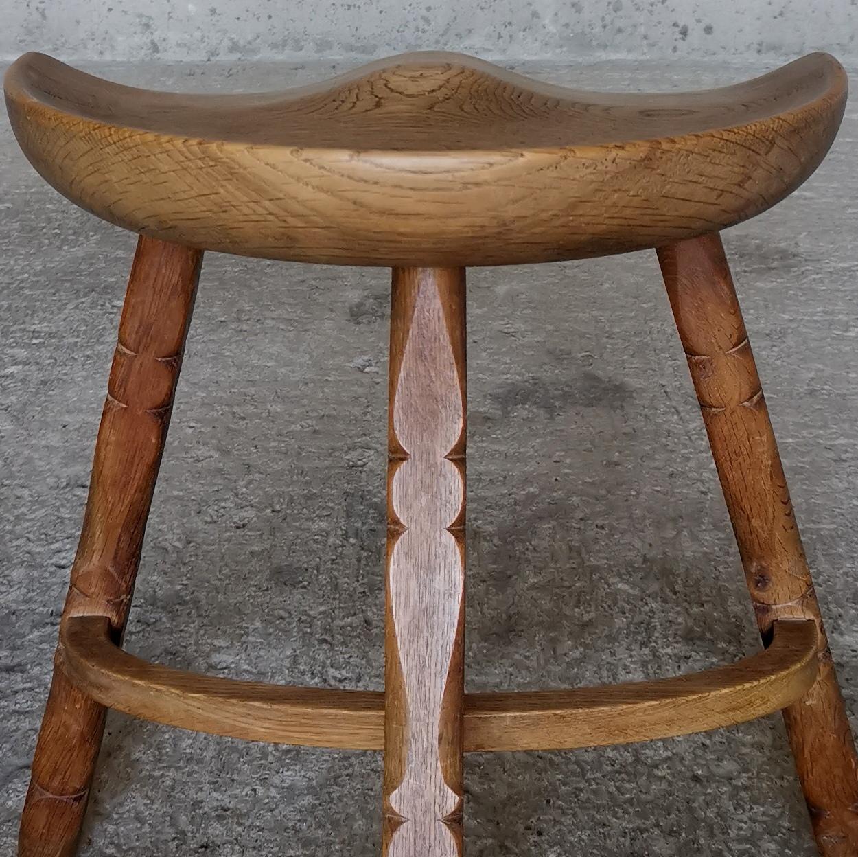 Solid oak stool in style of Henning Kjærnulf, hand sculpted seat, Denmark 1960s  In Good Condition For Sale In Ystad, SE