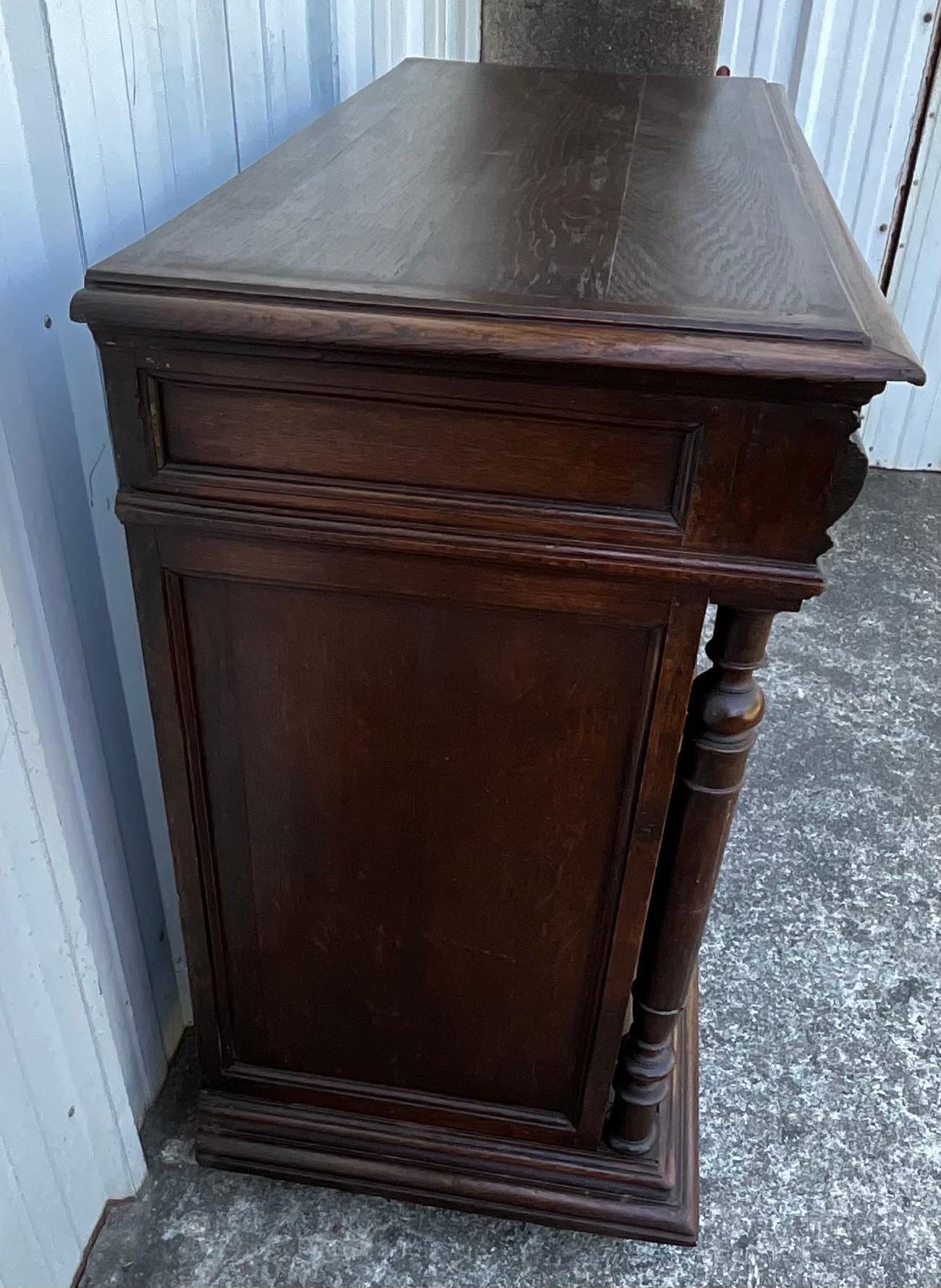 This charming side cabinet in solid oak captures the rustic elegance of the French country style from the late 19th century. Discovered in a traditional home nestled in the rolling hills of the Loire Valley, it stands out for its authenticity and