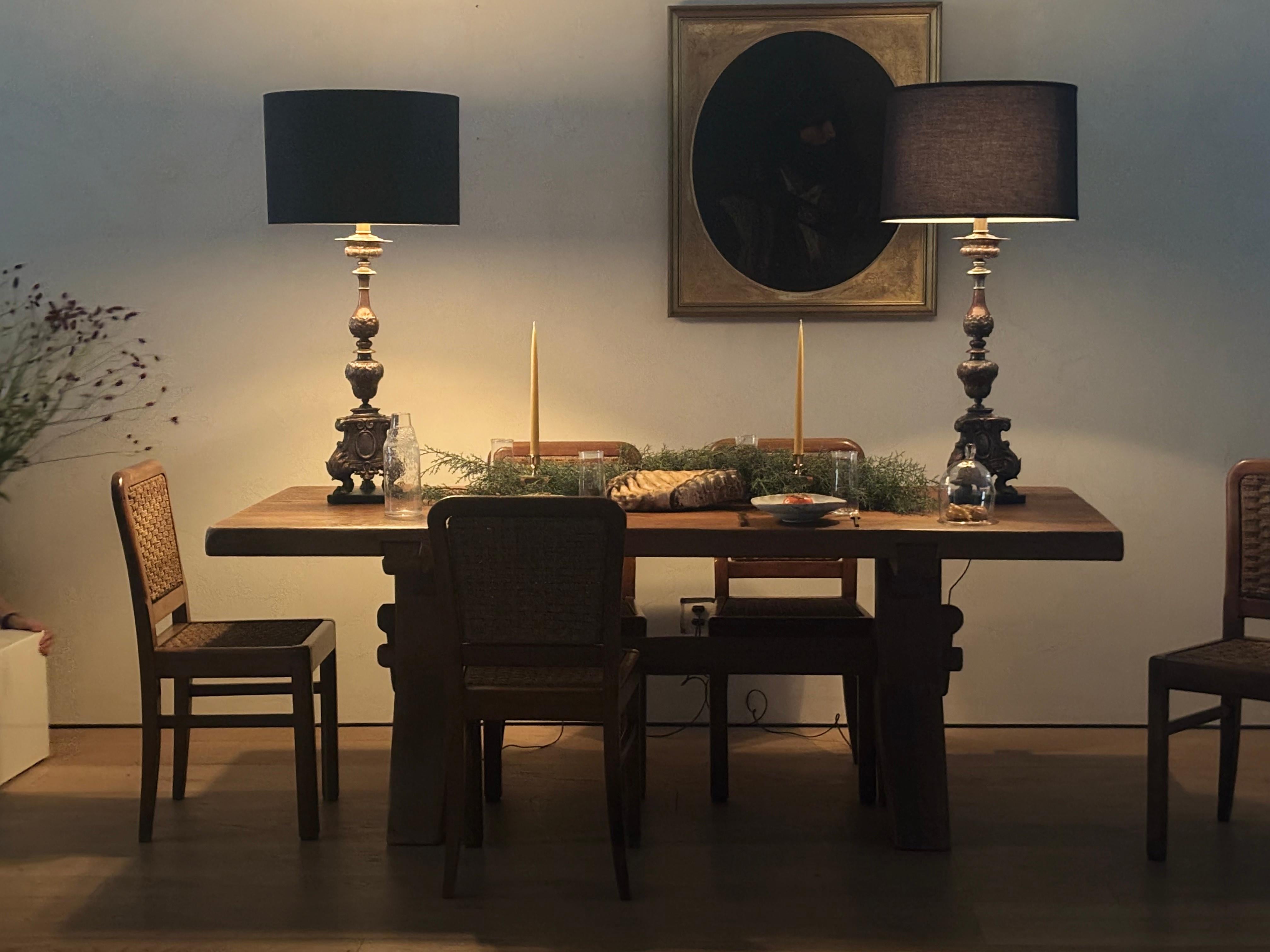 Influenced by the Brutalist movement, Belgian furniture maker De Puydt designed hand-carved furniture of substantial solid oak. The honest construction of this deceptively simple table, with its chiseled top and trestle base, is highlighted by the