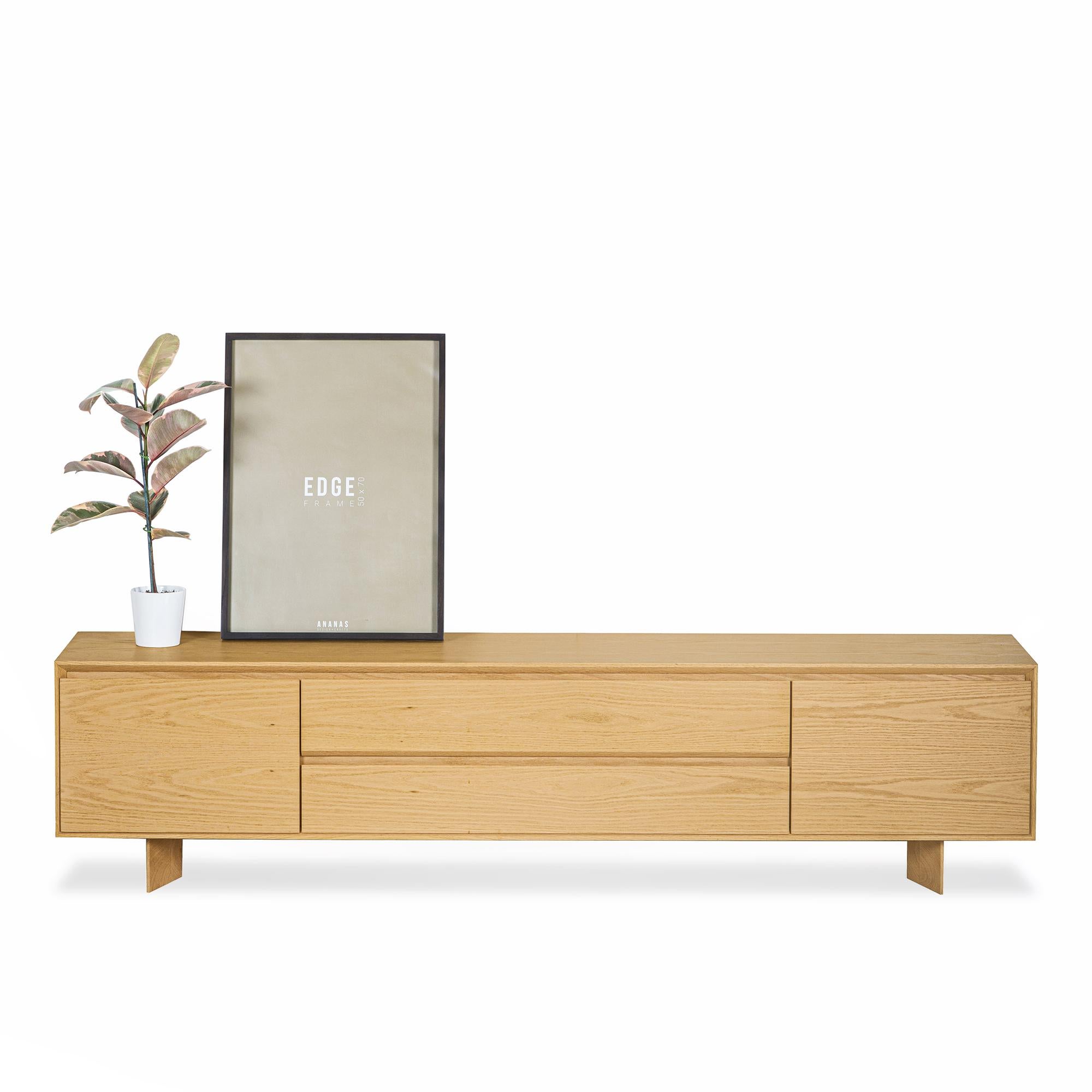 With its clean lines and design stripped of excess, the BEAM Series Solid Oak TV Unit seamlessly adapts to any interior style. Crafted from 100% solid oak wood, this piece combines natural materials with high-quality craftsmanship, offering a