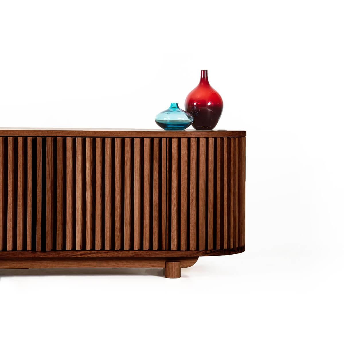 The DOCIA Series Solid Oak TV Unit stands out with its natural wood texture and functional elegance, offering both aesthetic warmth and practical use. Crafted entirely from natural oak wood, every detail of this unit adds a cozy and inviting feel to