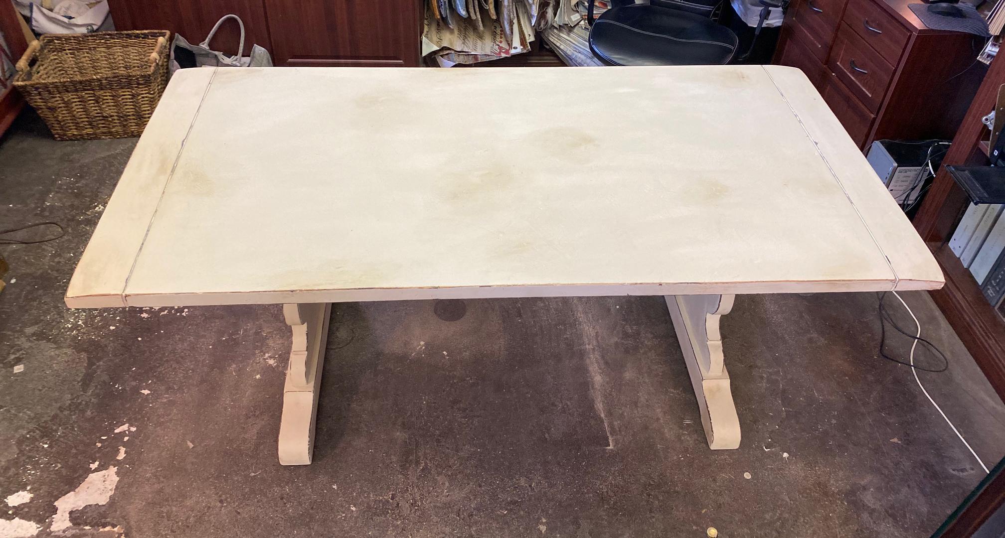 Vintage kitchen/dining table. Solid oak and recently painted in a distressed cream and finished in a variation of clear and dark wax for added depth. This finish can be cleaned with a damp cloth and is very durable for everyday use. Please see