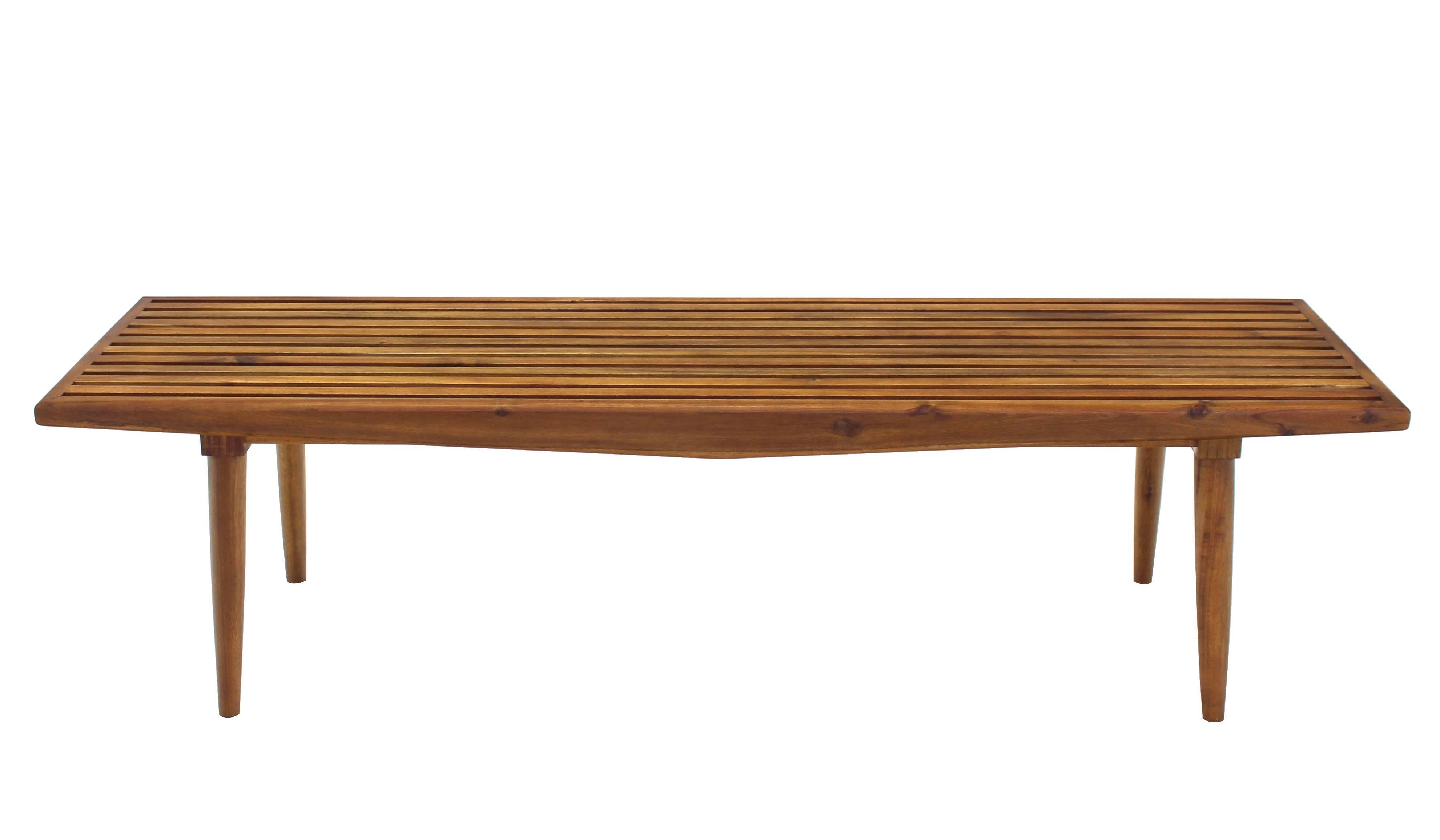 Established lines midcentury Danish modern decor oiled walnut finish solid acacia slat bench or coffee table.