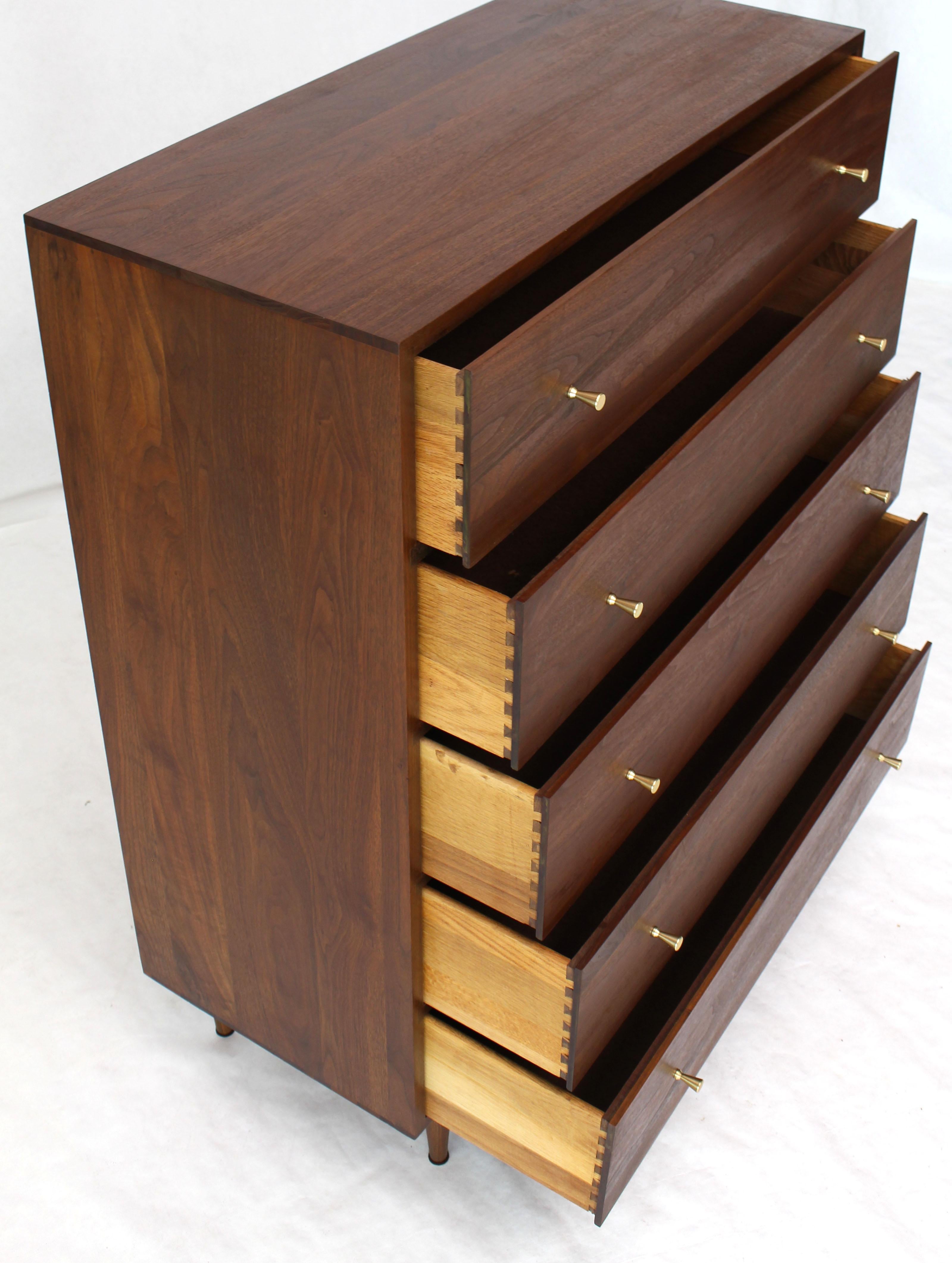 Mid-Century Modern all solid walnut cabinet finished with oil. Beautiful wood grain soiled brass pulls. Attributed to P. McCobb.