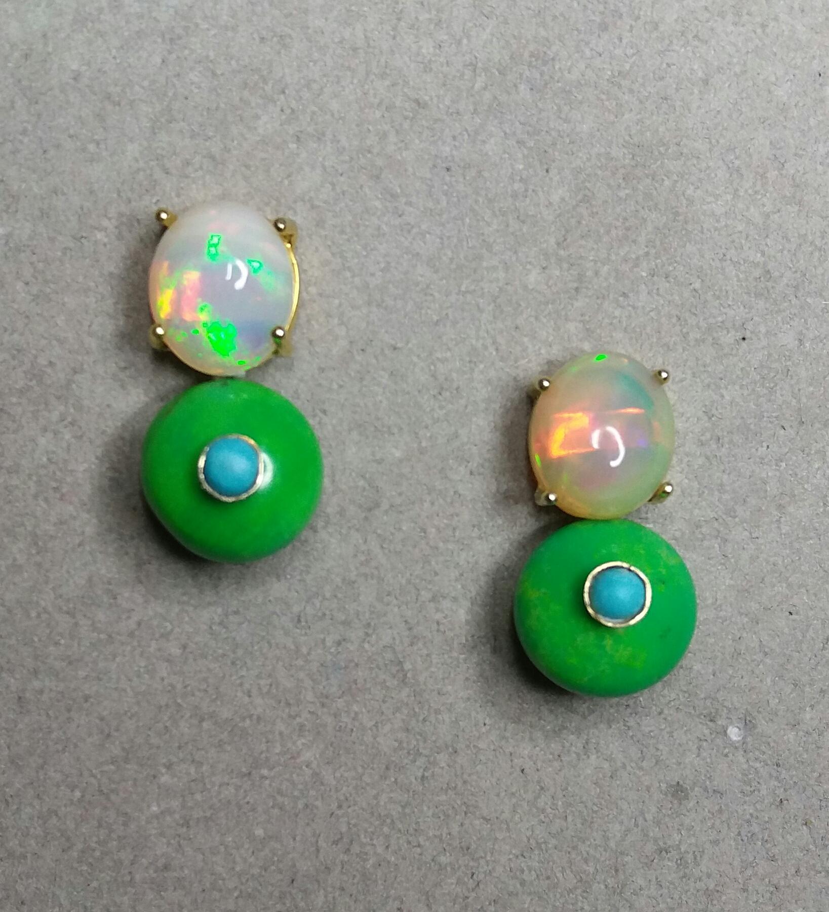 Simple chic stud earrings with a pair of Oval Solid Opal Cabs measuring 9 x 11 mm set in solid 14 Kt. yellow gold on the top and in the lower parts 2 Turkmenistan Green Turquoise round buttons of 12 mm in diameter,with 2 small 3mm round Blue