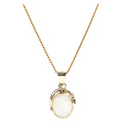 Solid Oval Opal Cabochon 9 Carat Yellow Gold Pendant with 9 Carat Gold Chain