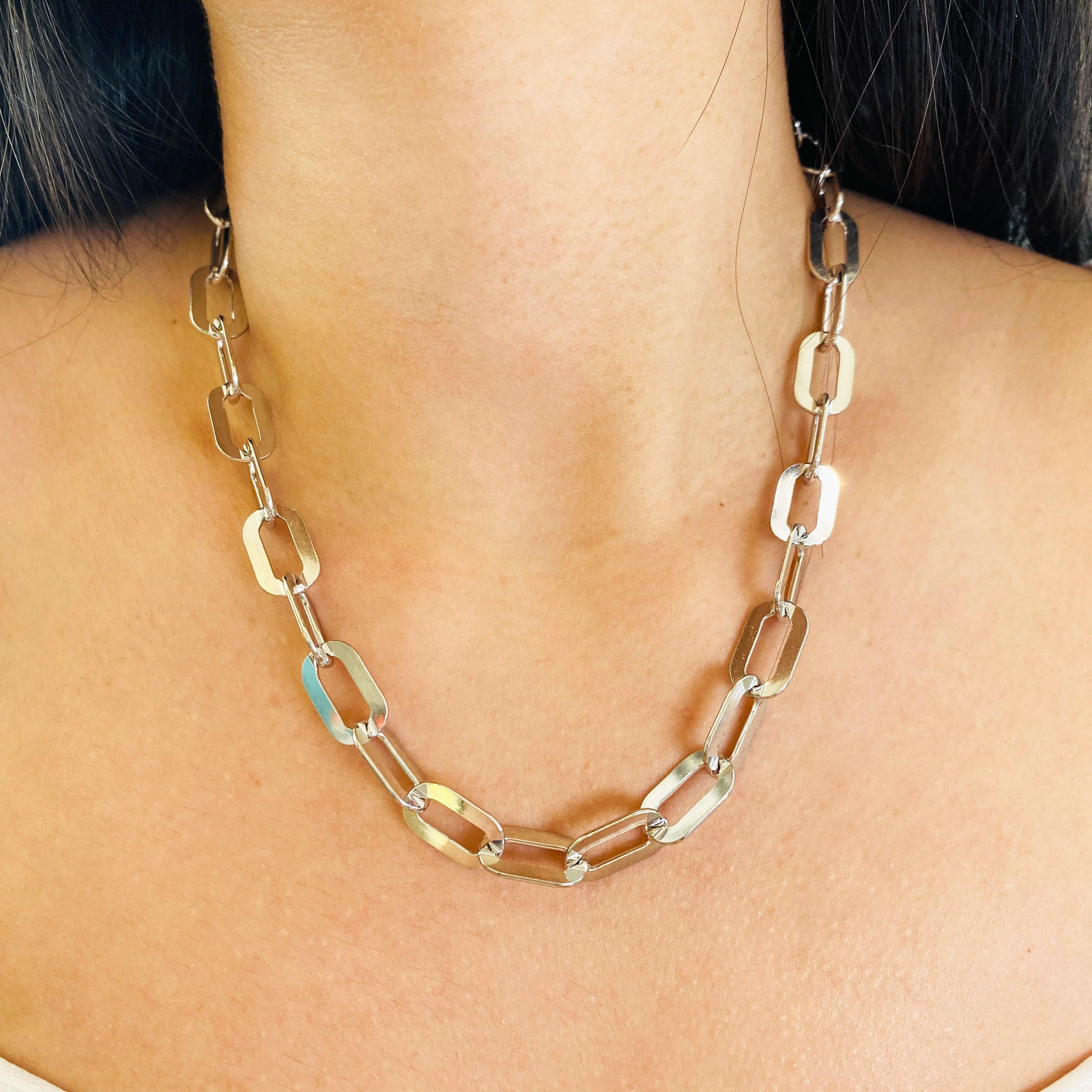 Paperclip chains are making a splash as stylish and modern pieces to compliment any outfit! This substantial and stunning 10 millimeter (mm) wide paperclip flat link necklace was made for us in Italy with recycled sterling silver and finished