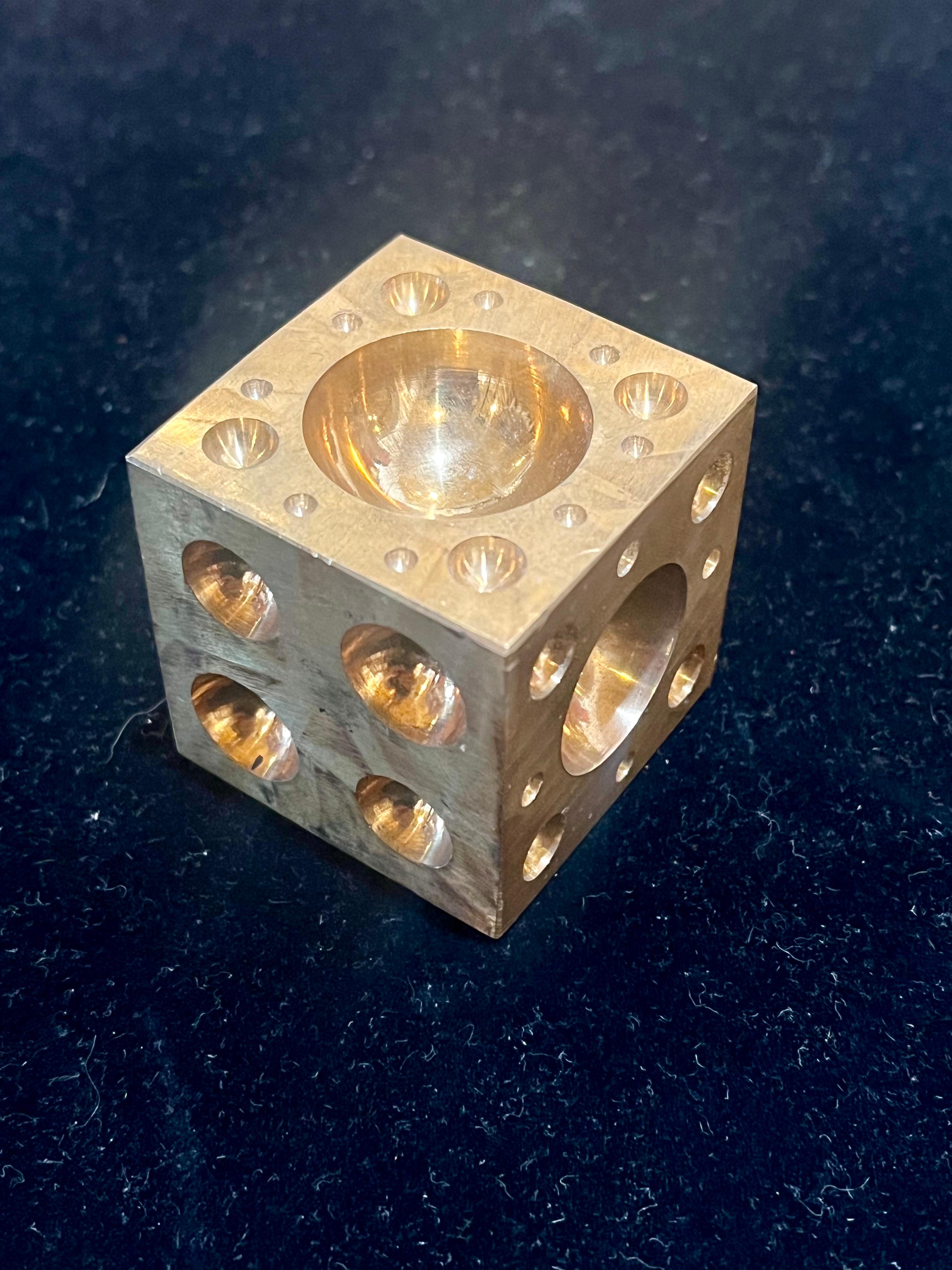 Nice and heavy unique paper weight sculpture, in solid brass each side comes with different sizes holes, circa 1970s.
