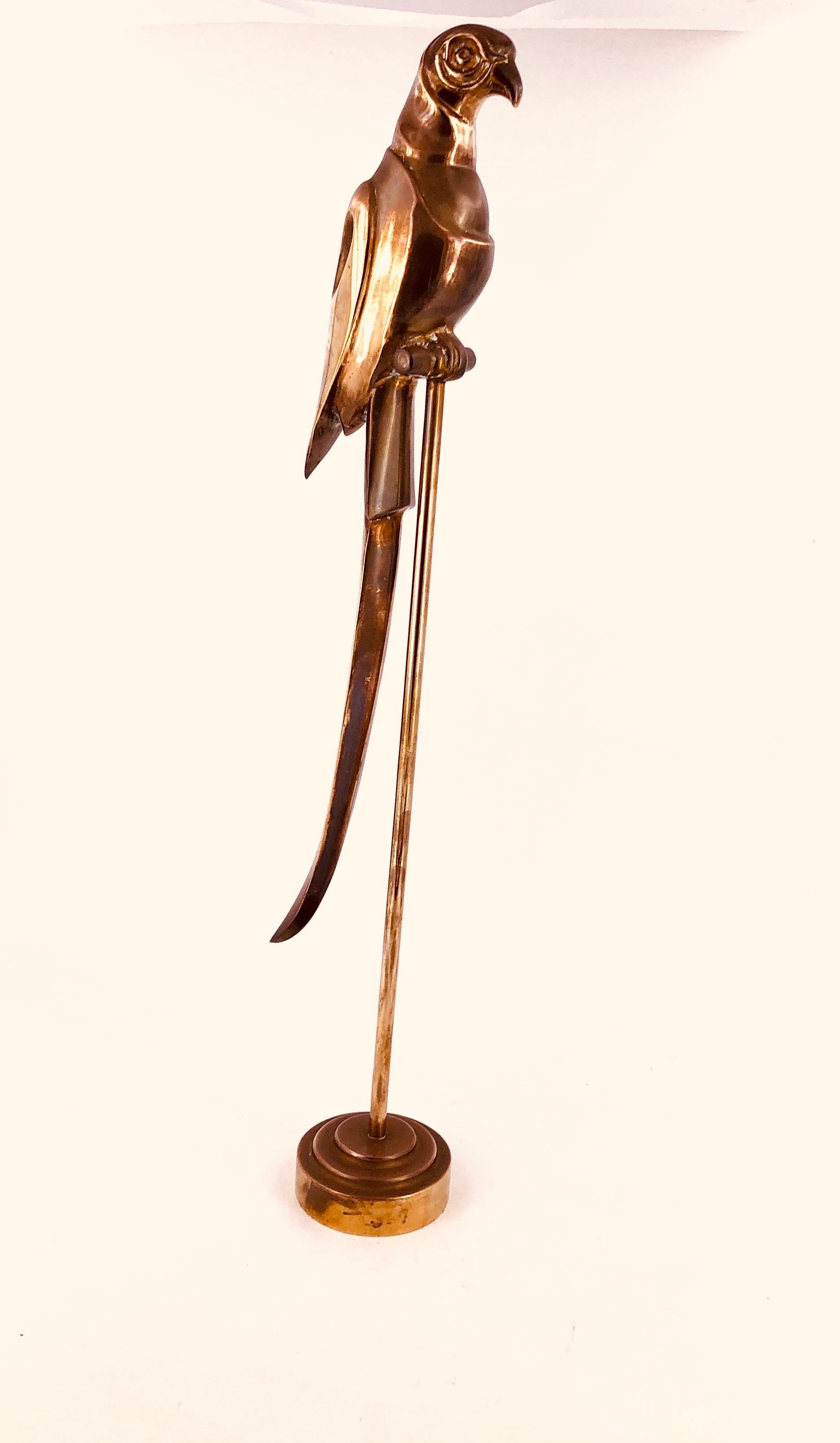 A beautiful and well done solid brass sculpture, of a parrot on perch stand circa 1970s, can be polished to a bright finish we left the original patina finish.