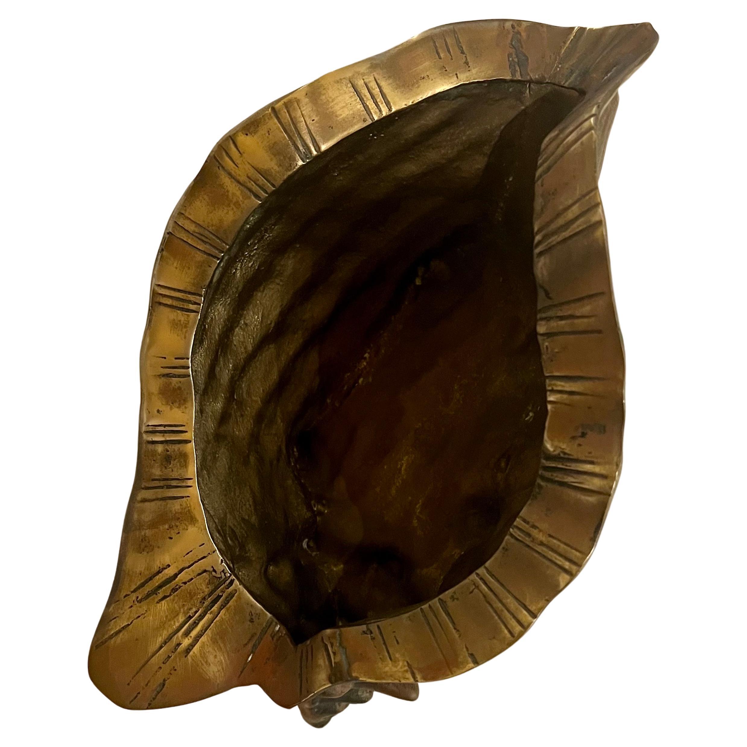 Beautiful decorative solid patinated brass conch, can be used as a planter or catch it all, circa 1970s nice patina that can be polished.