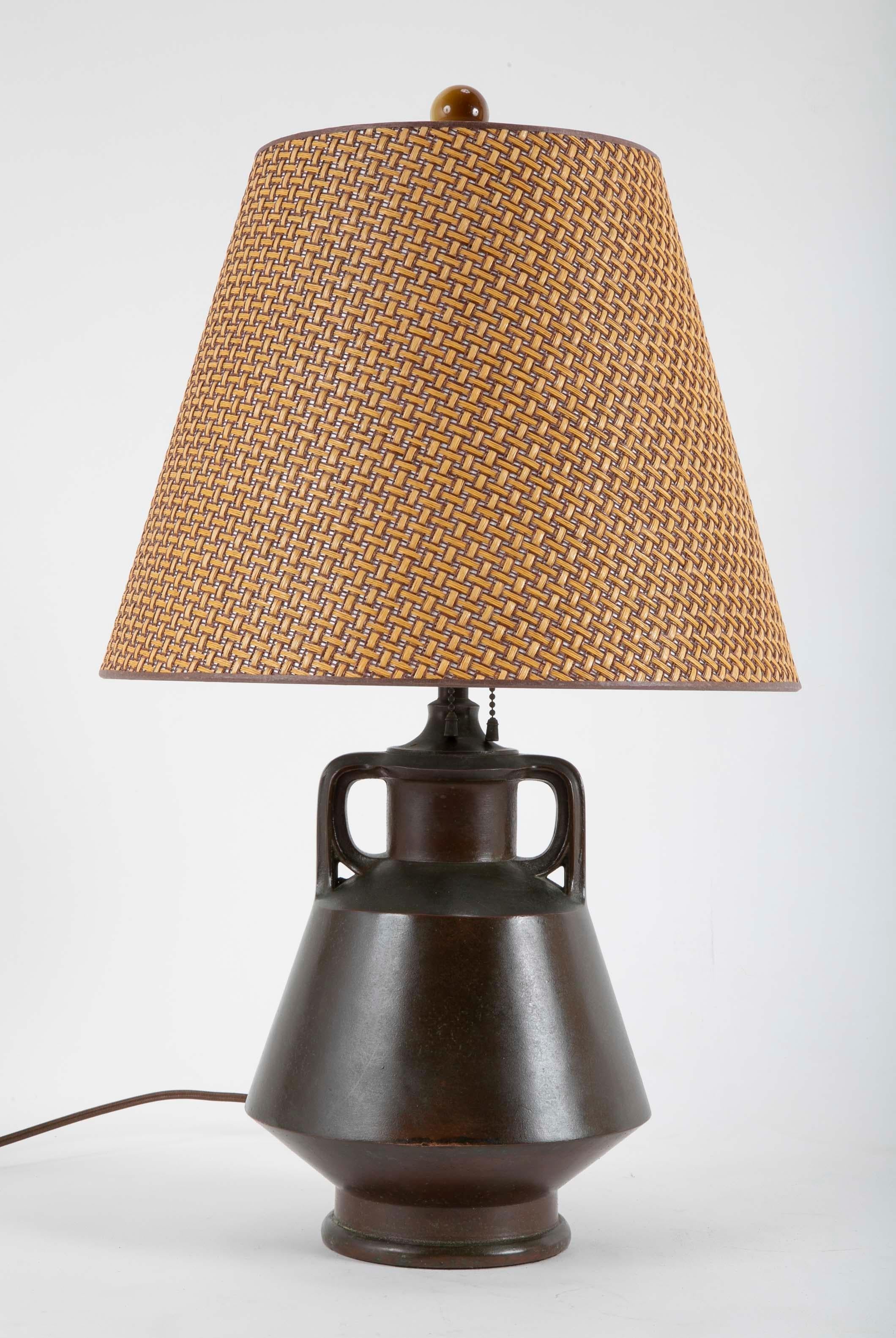A solid patinated bronze lamp. Newly rewired. 

Shade: 14