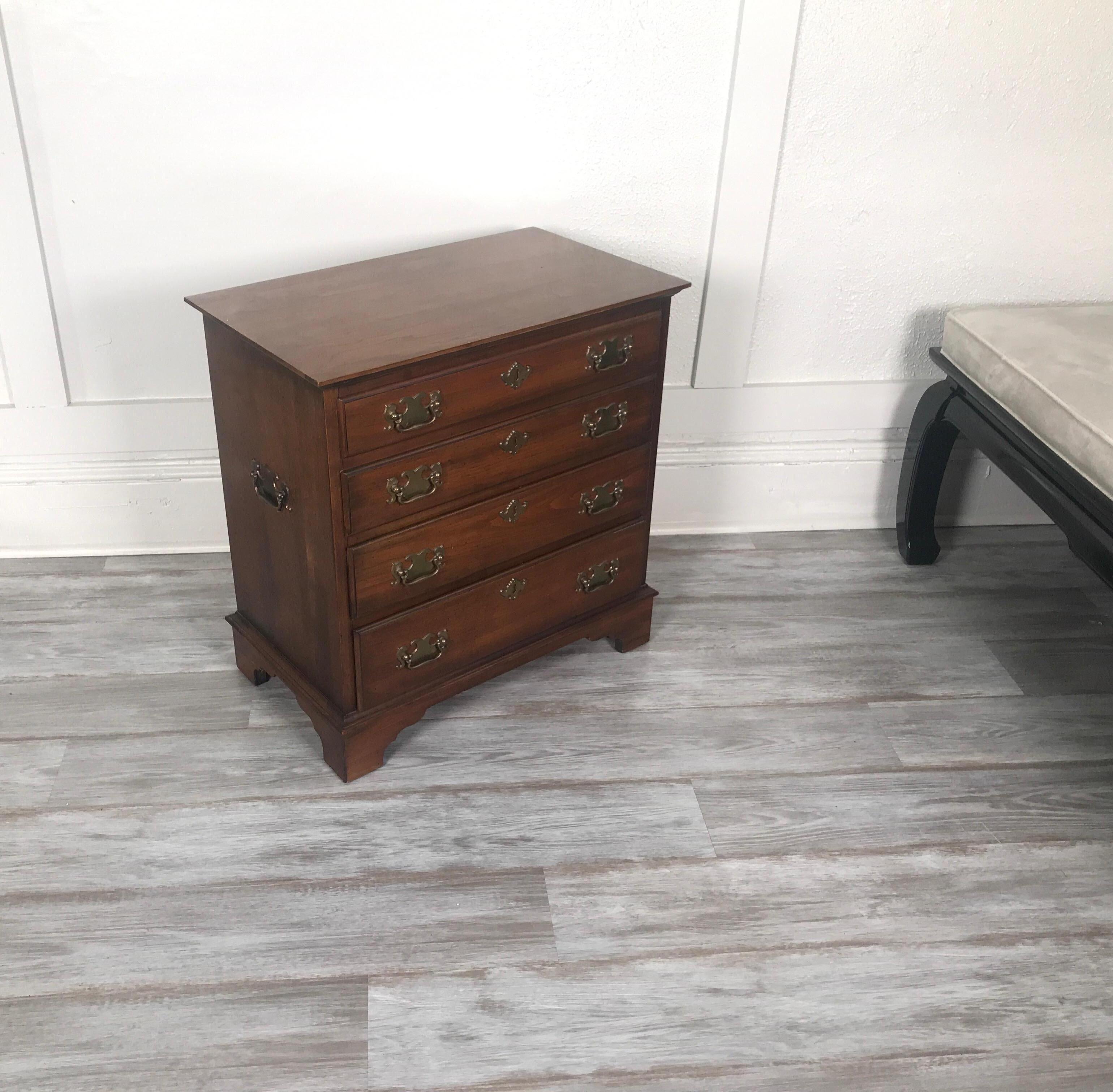 A smaller version of an American and English Classic bachelors chest. Done is solid cherry by Pennsylvania House Furniture maker with four graduated drawers and beautifully finished back.