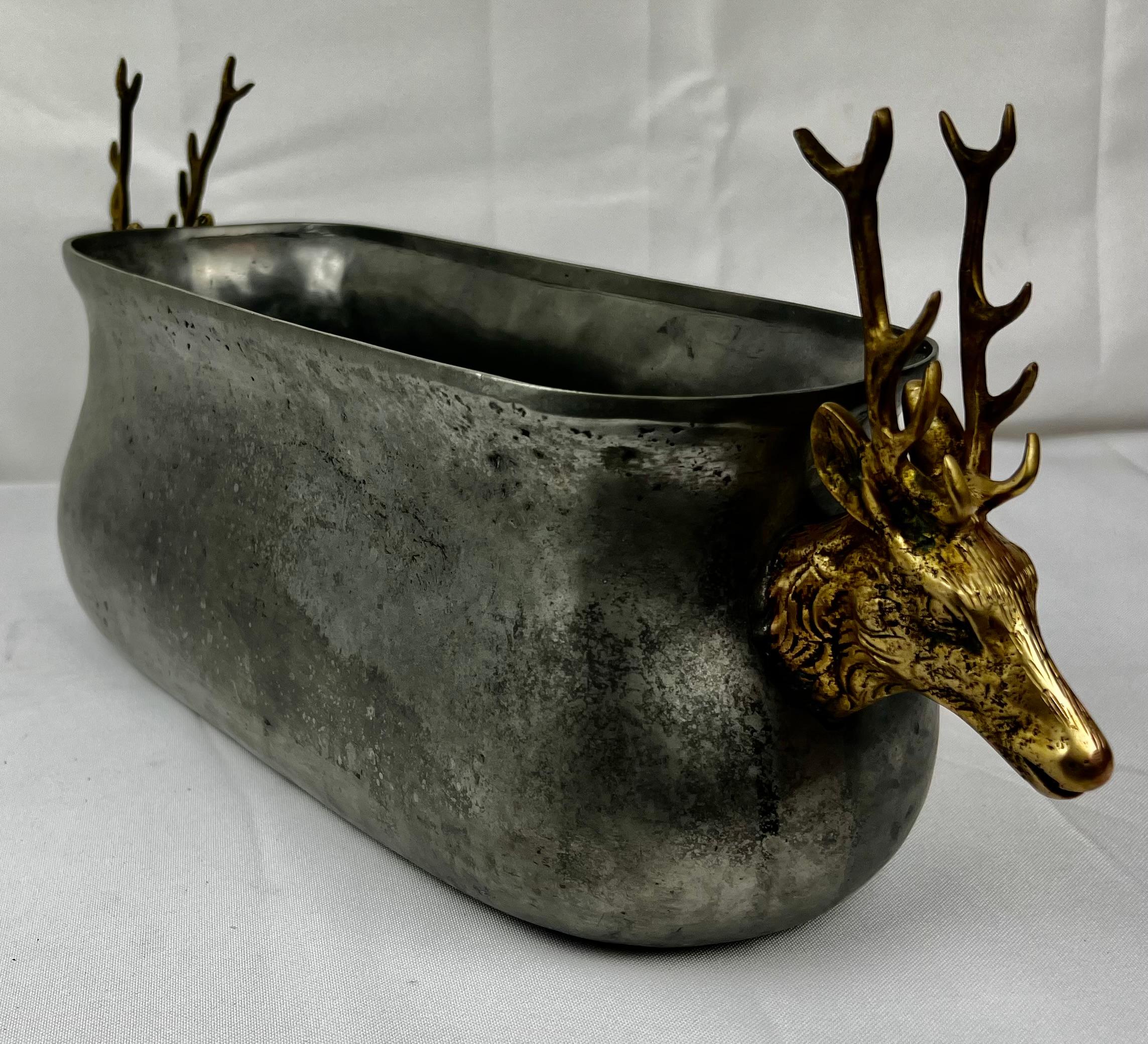 Hand made solid pewter container with brass stag head handles. It could be used a s a centerpiece, planter or even to chill bottles of wine.
Clearly marked on the underside “Fecit (he made) VCM made in Portugal. It was purchased in Saks Fifth