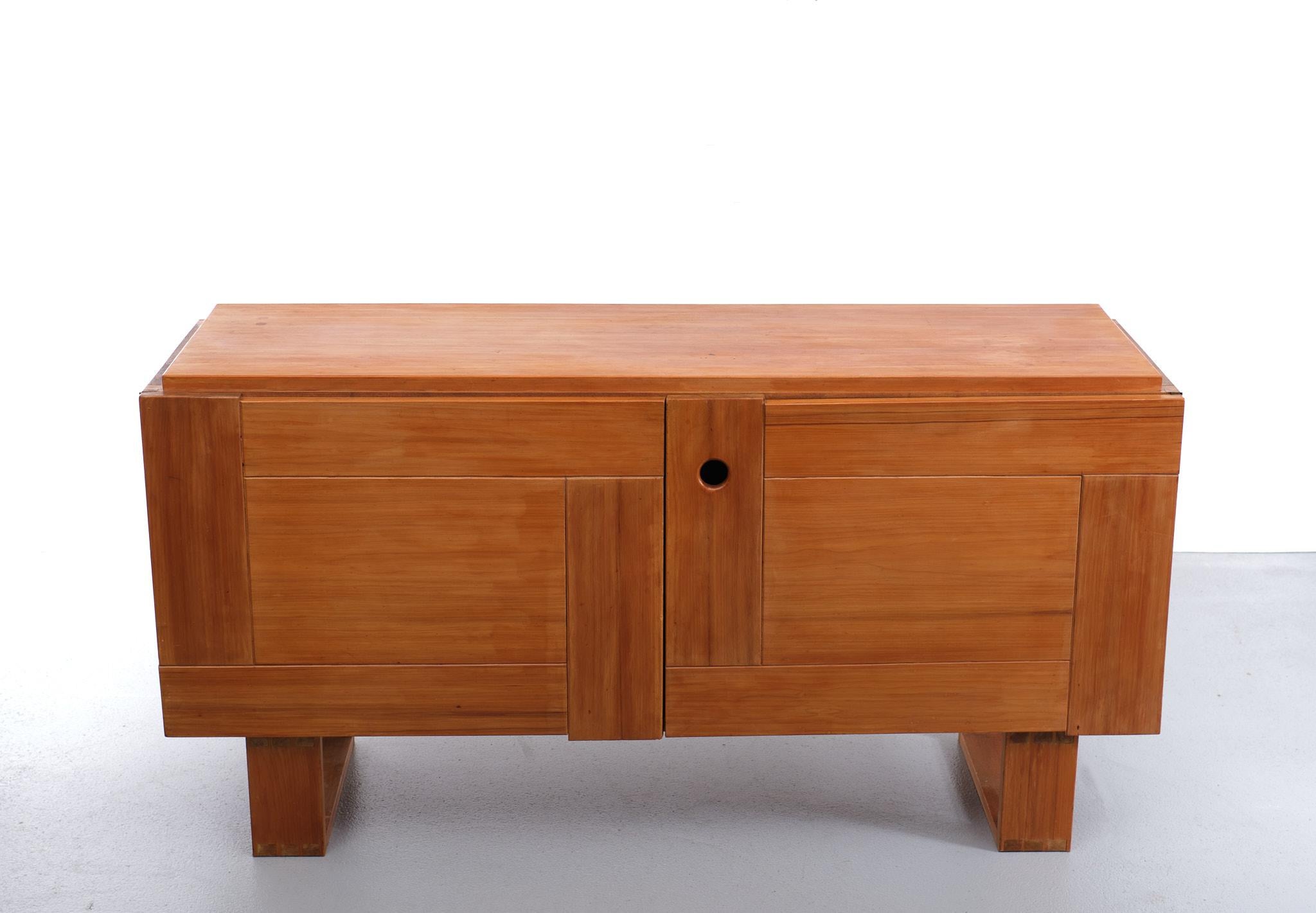 Very nice rustic sideboard. looks like hand made. Solid Pine.
Two doors. Inside. Three sliding drawers,Three shelves. 
in the manor off Charlotte Perriand Unique and beautiful piece.