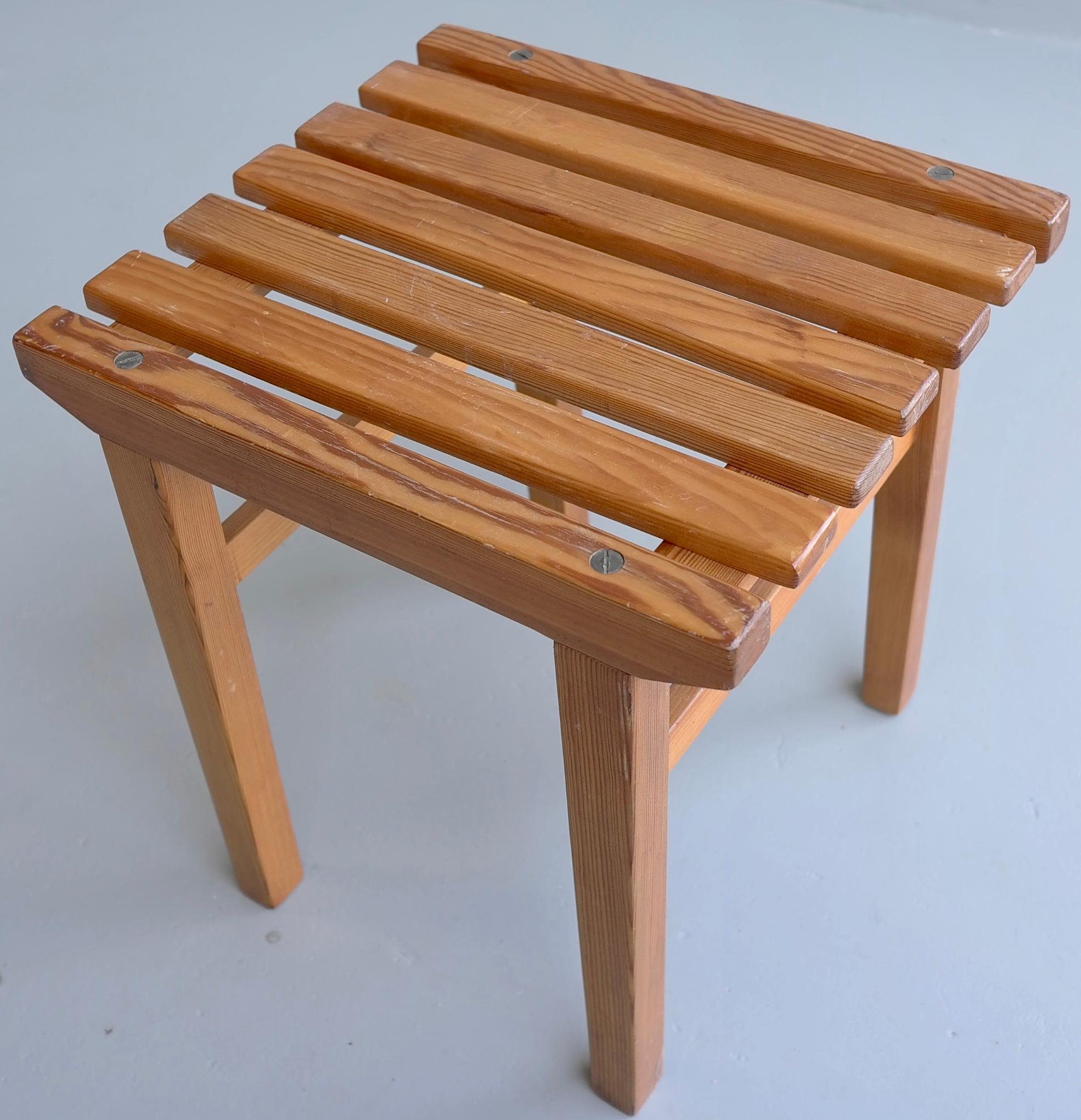 Solid pine midcentury slats stool, Sweden, 1960s.
Nice detail: finished with 4 large brass screws. Can also be used as a side table.