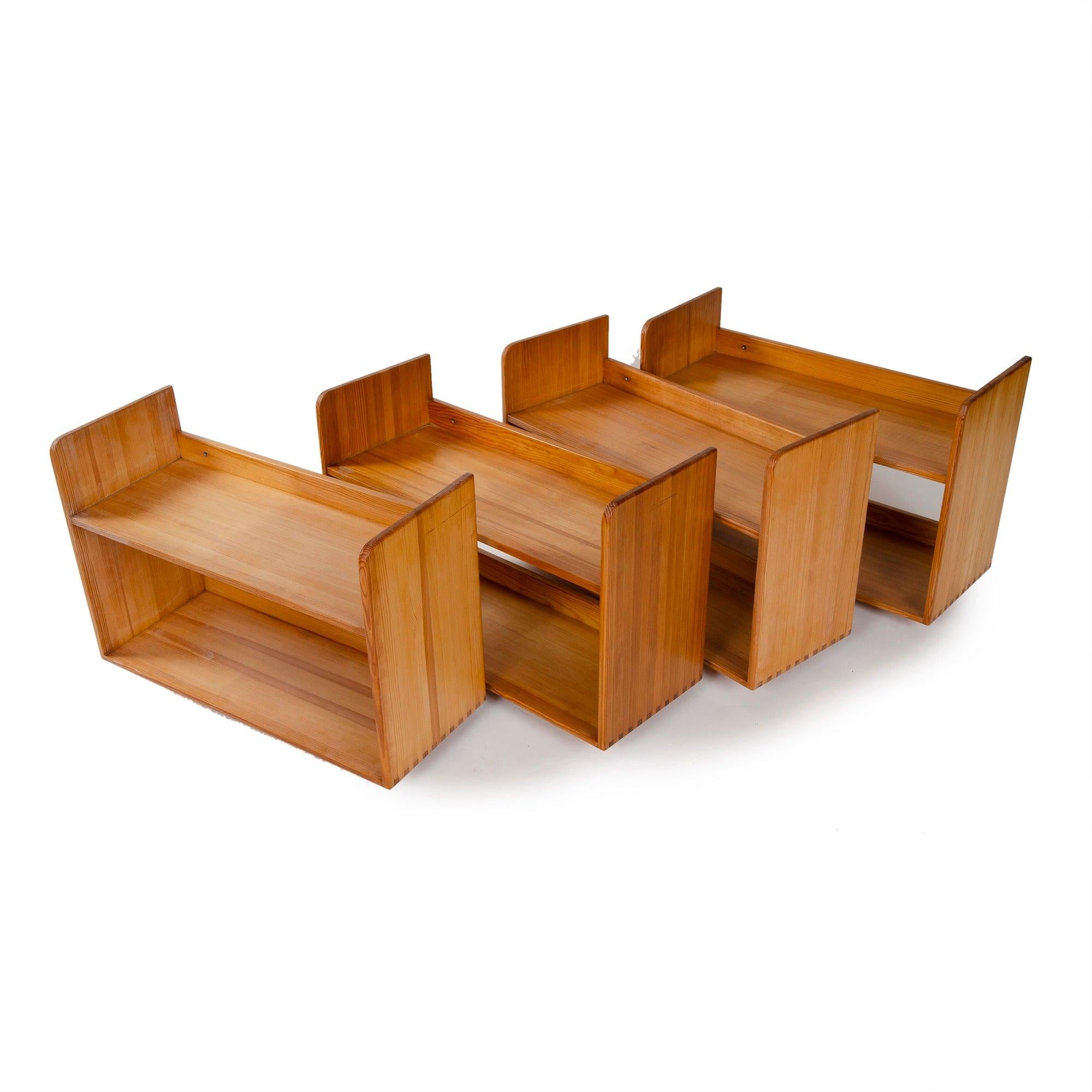 A wall mount shelf unit made of solid pine, crafted with a finger joint along the bottom edges.