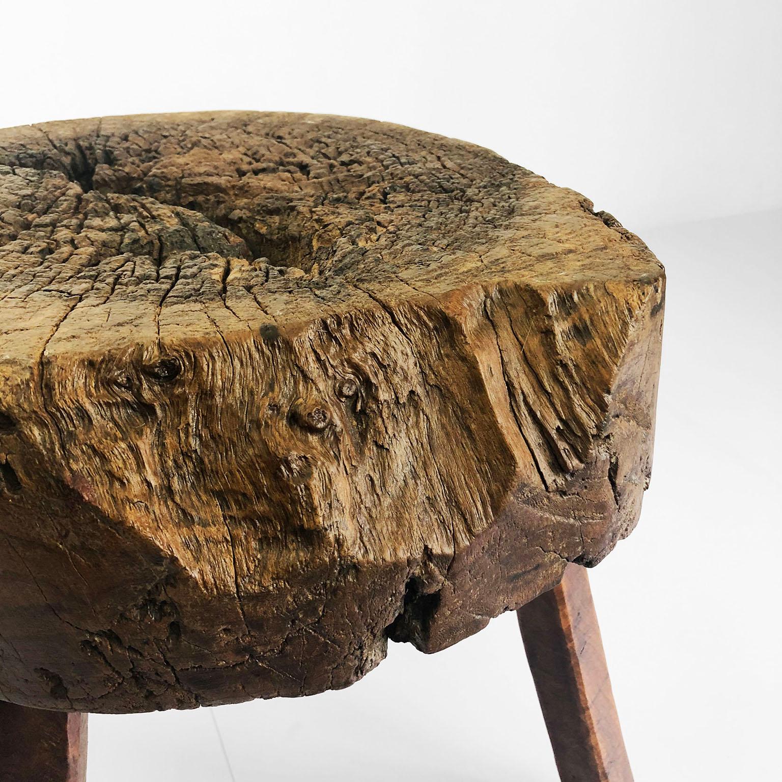 We offer this stool made in Mesquite hardwood, circa 1930. Made in Mexico hand carved using machete and chisel. Fully restored. Clear markings showing age and heavy use, ready to use as stool or side table.