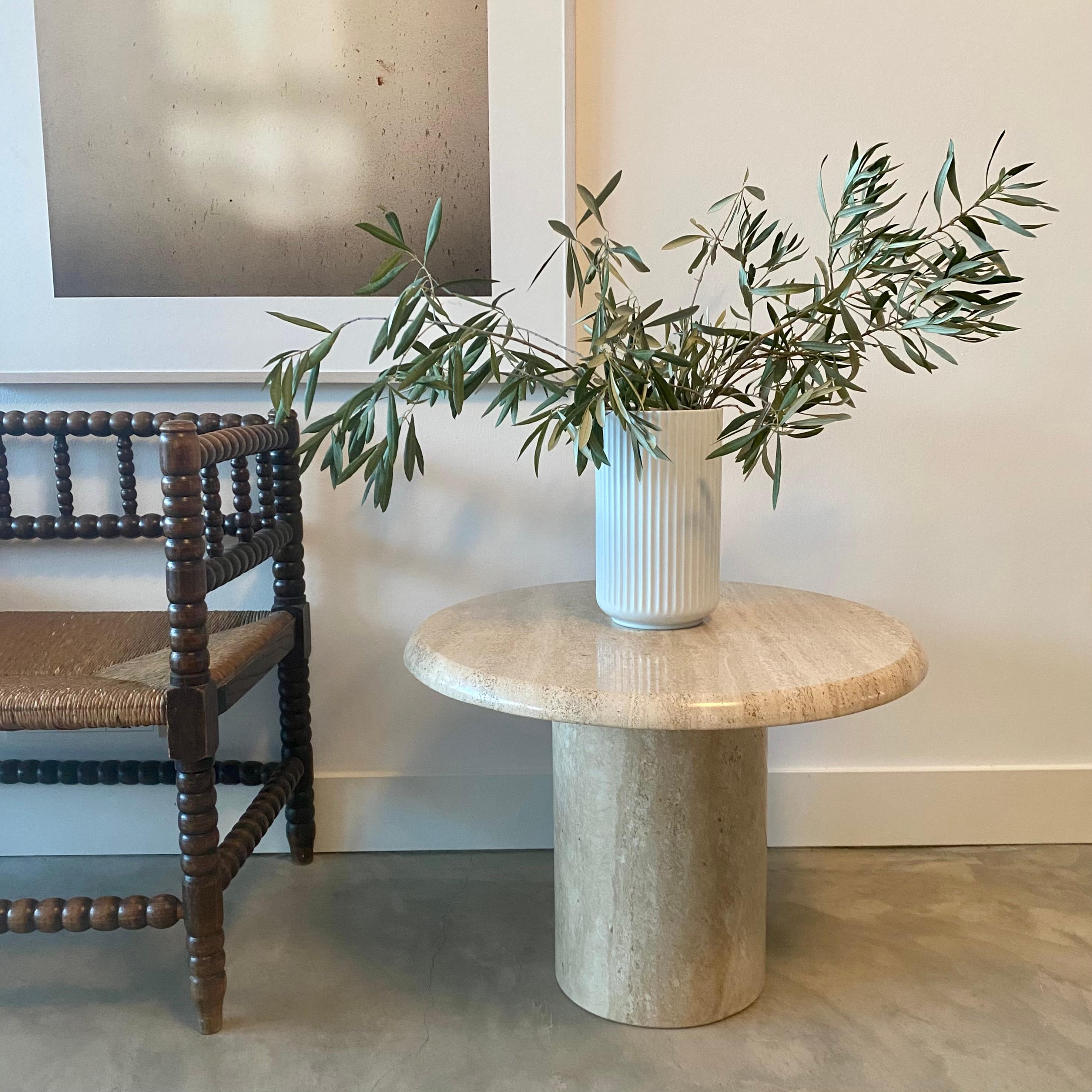 Introducing the perfect addition to your home decor, a solid round Roman Travertine coffee table. This beautiful piece of Italian design from 1970 is sure to make a statement in any room.

Crafted from stunning Roman Travertine, this coffee table