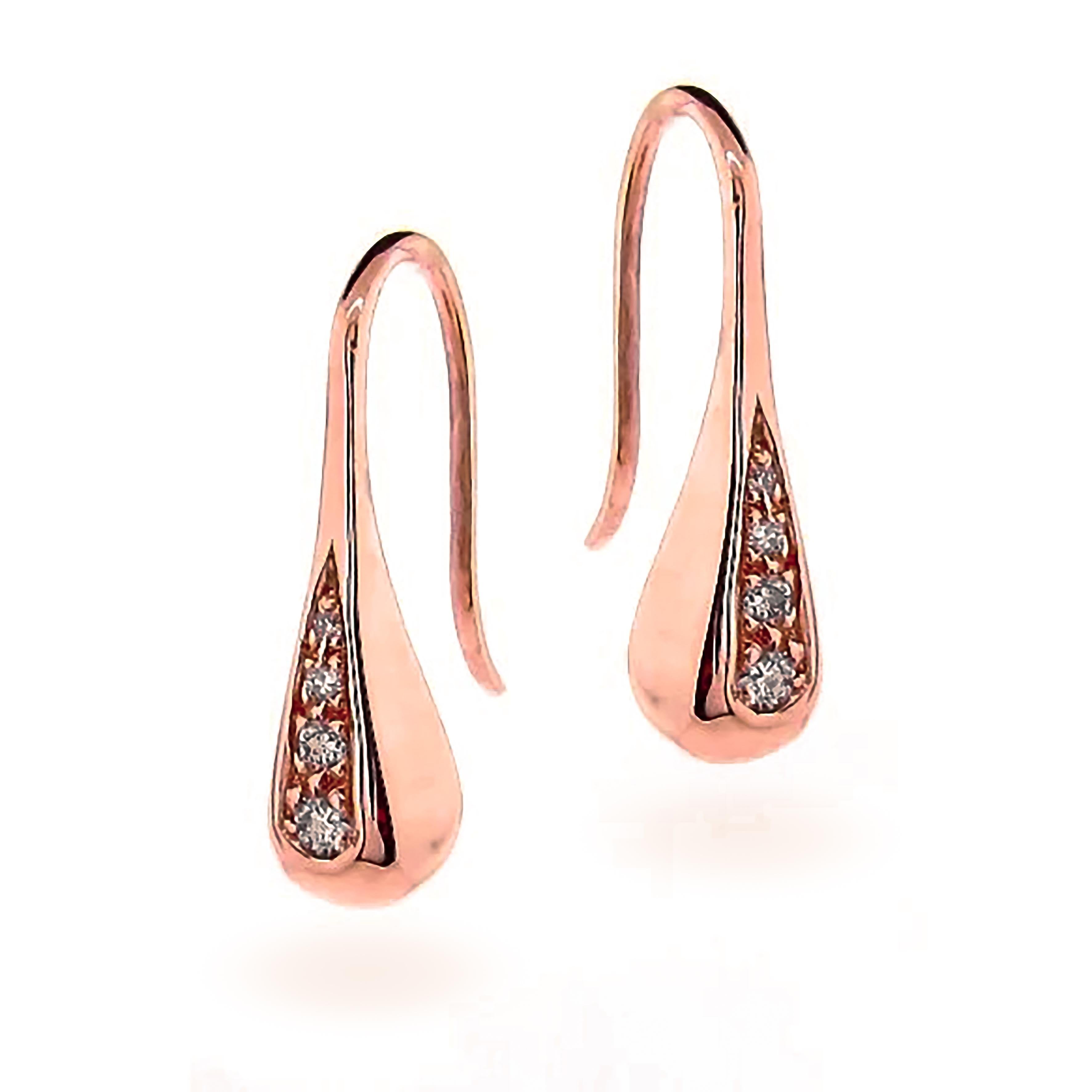 Add a touch of elegance to your wardrobe with these stunning 9 karat solid rose gold diamond droplet earrings. These simple yet sophisticated statement earrings are perfect for both everyday work wear and special occasions.

The earrings feature a
