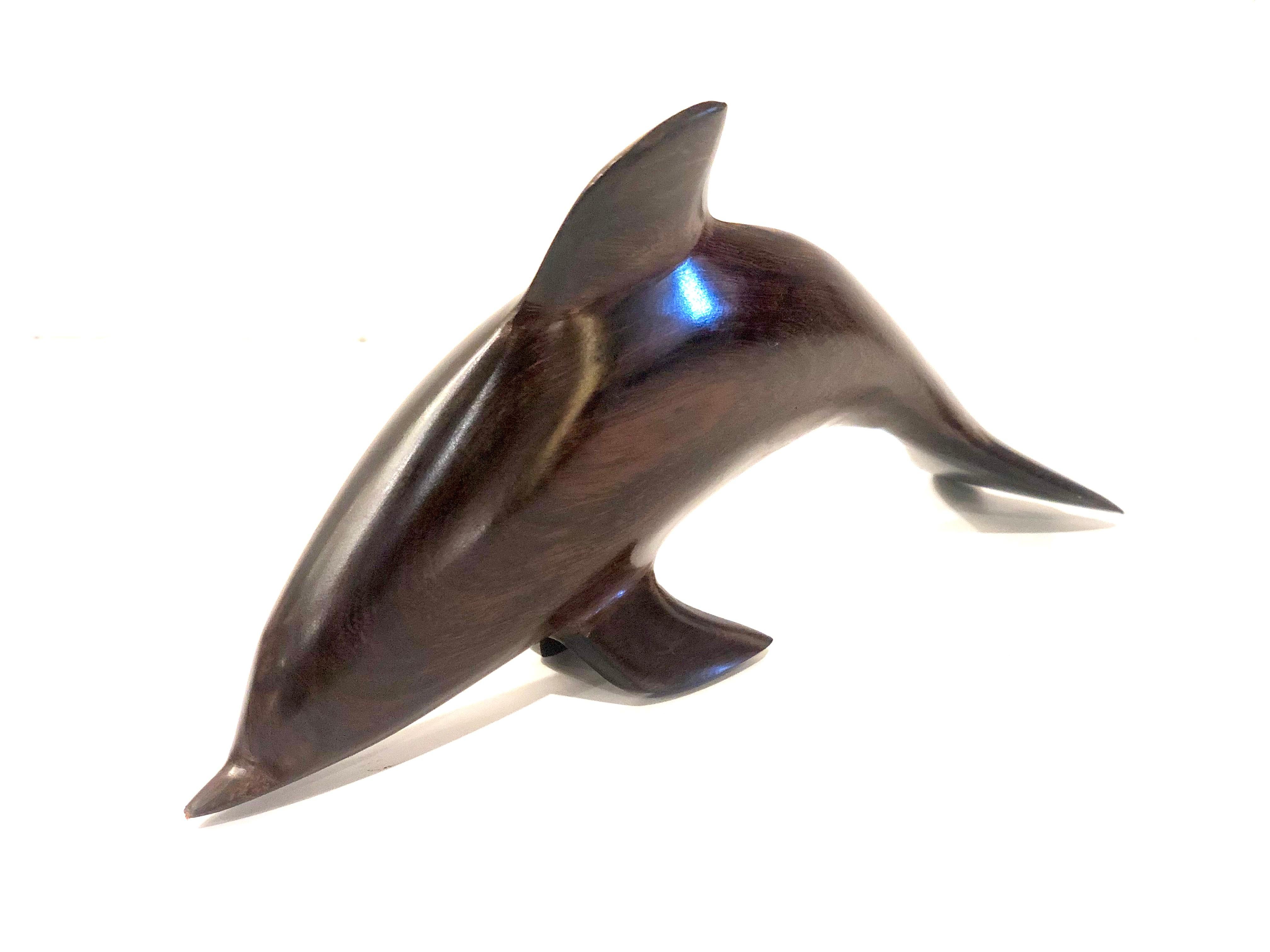 Beautiful solid rosewood handcrafted dolphin sculpture, circa 1970s nice condition and finish.