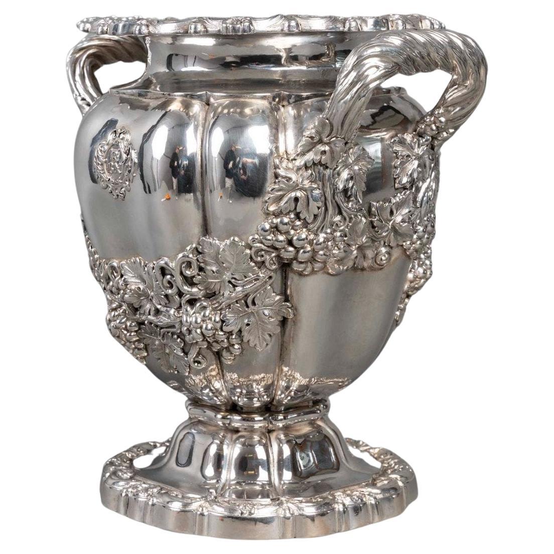 Solid silver cooler in the “Medici” shape, the round scalloped base is decorated For Sale